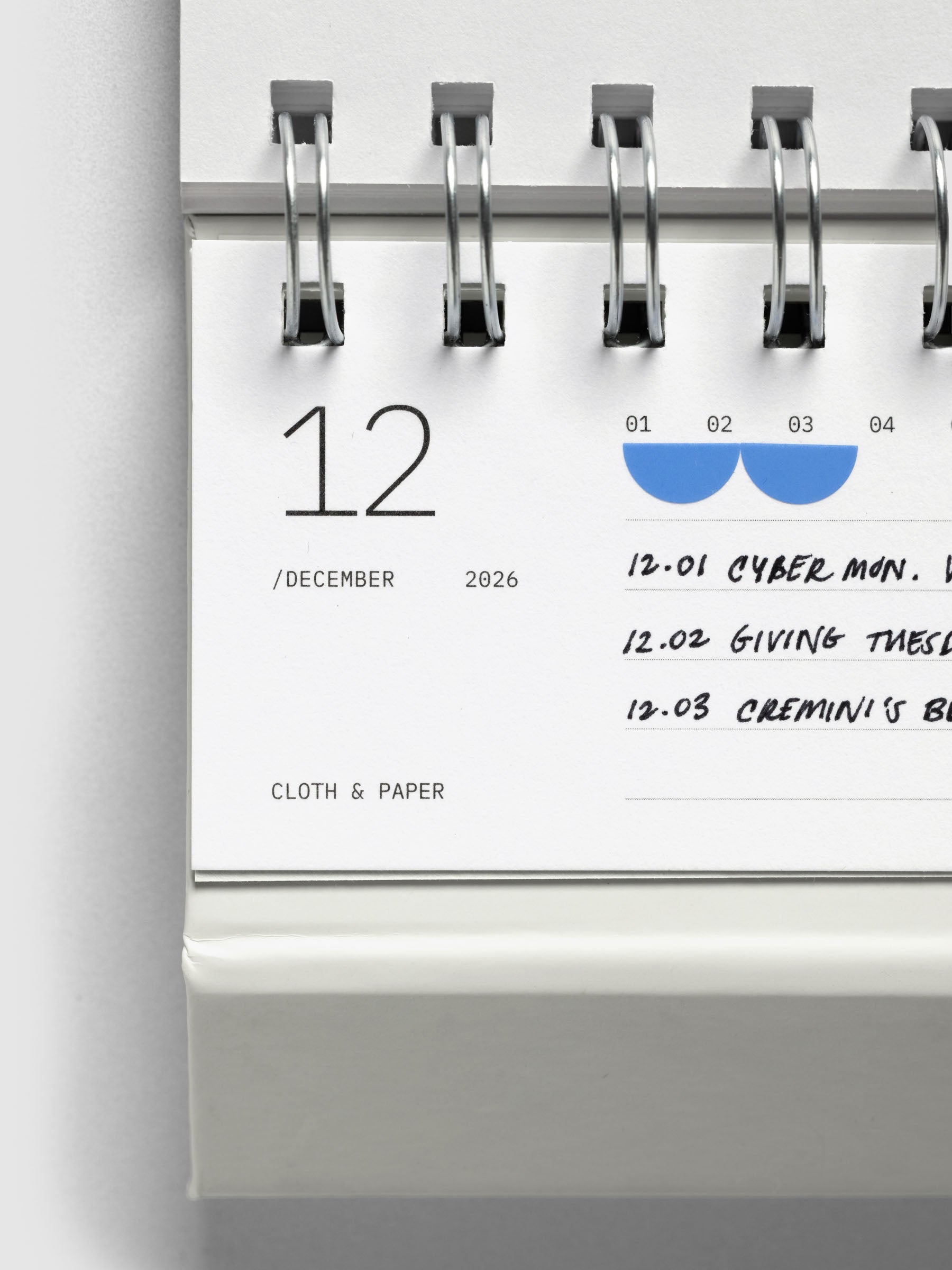 Close up of 2026 Spiral Desk Calendar shown folded and flat, displaying a calendar page.