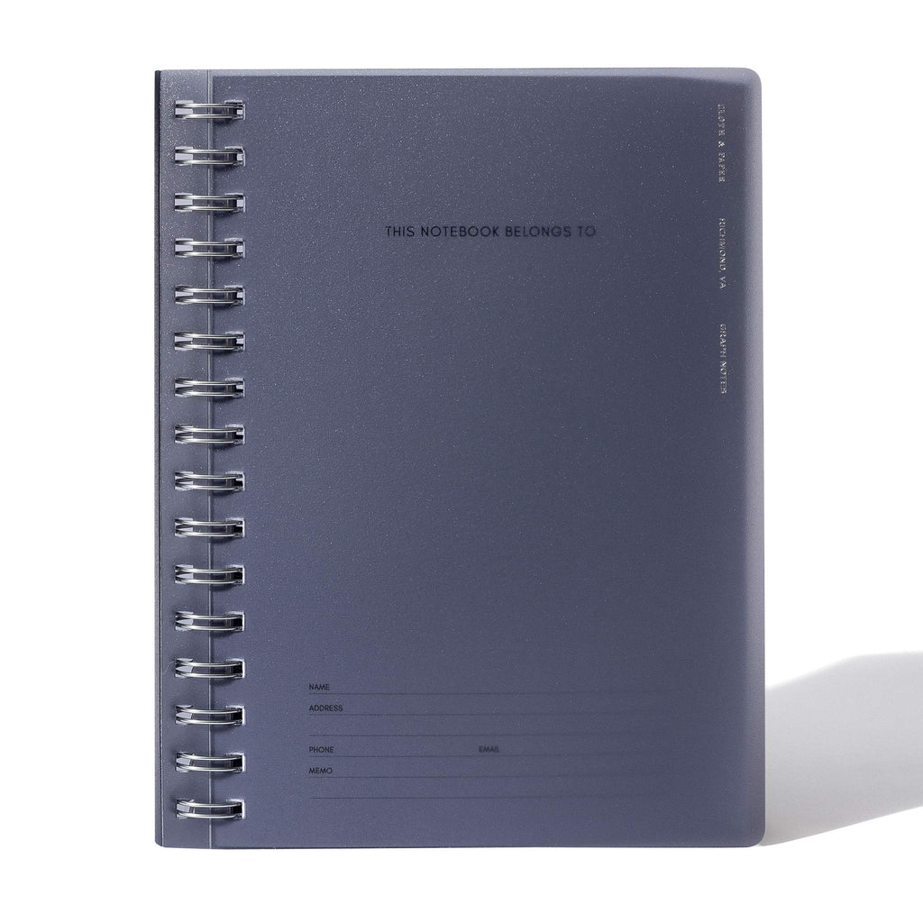 Tinted plastic notebook displayed on a white background.
