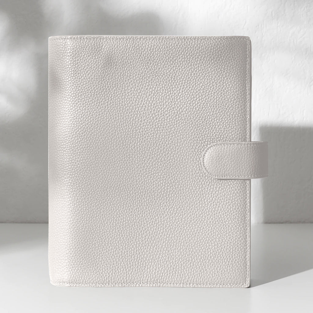 Ash leather agenda displayed on an off-white background.