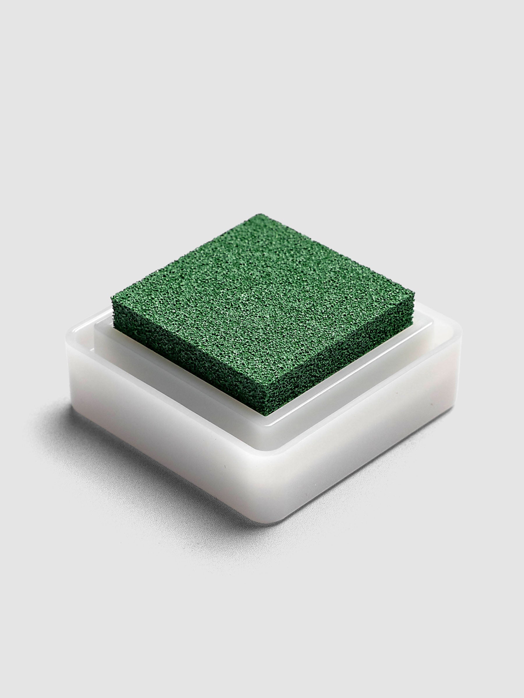 Artnic Stamp Ink Pad in olive seen from the side with cover removed