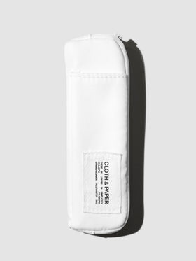 Adjustable Notebook Pouch, Cloth and Paper. Notebook pouch displayed with its packaging on a neutral background. Color shown is Le Blanc.