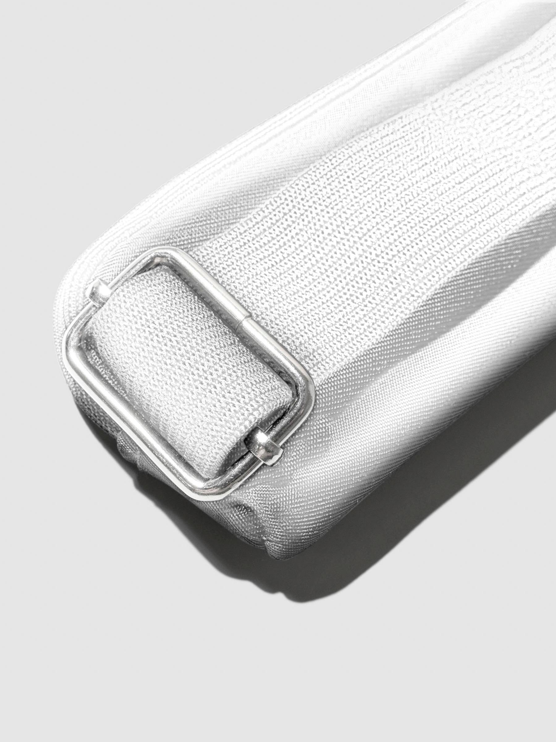 Closeup of strap on Le Blanc pouch.