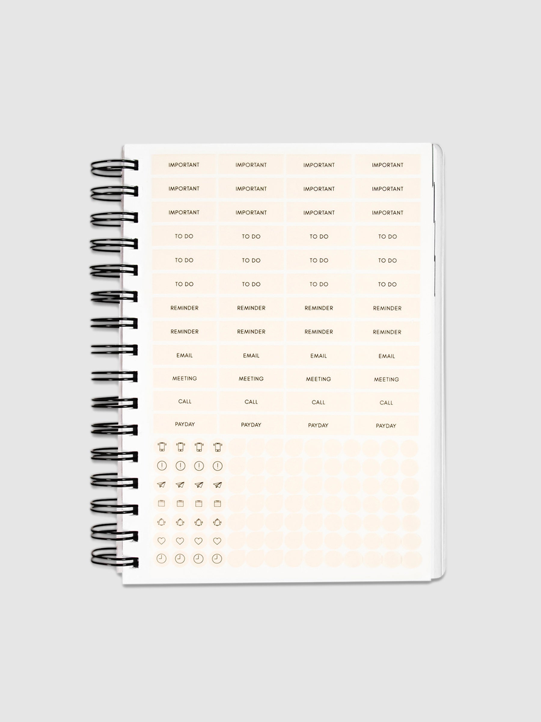 Planner Stickers in a 2022 Spiral Bound Planner on a neutral background