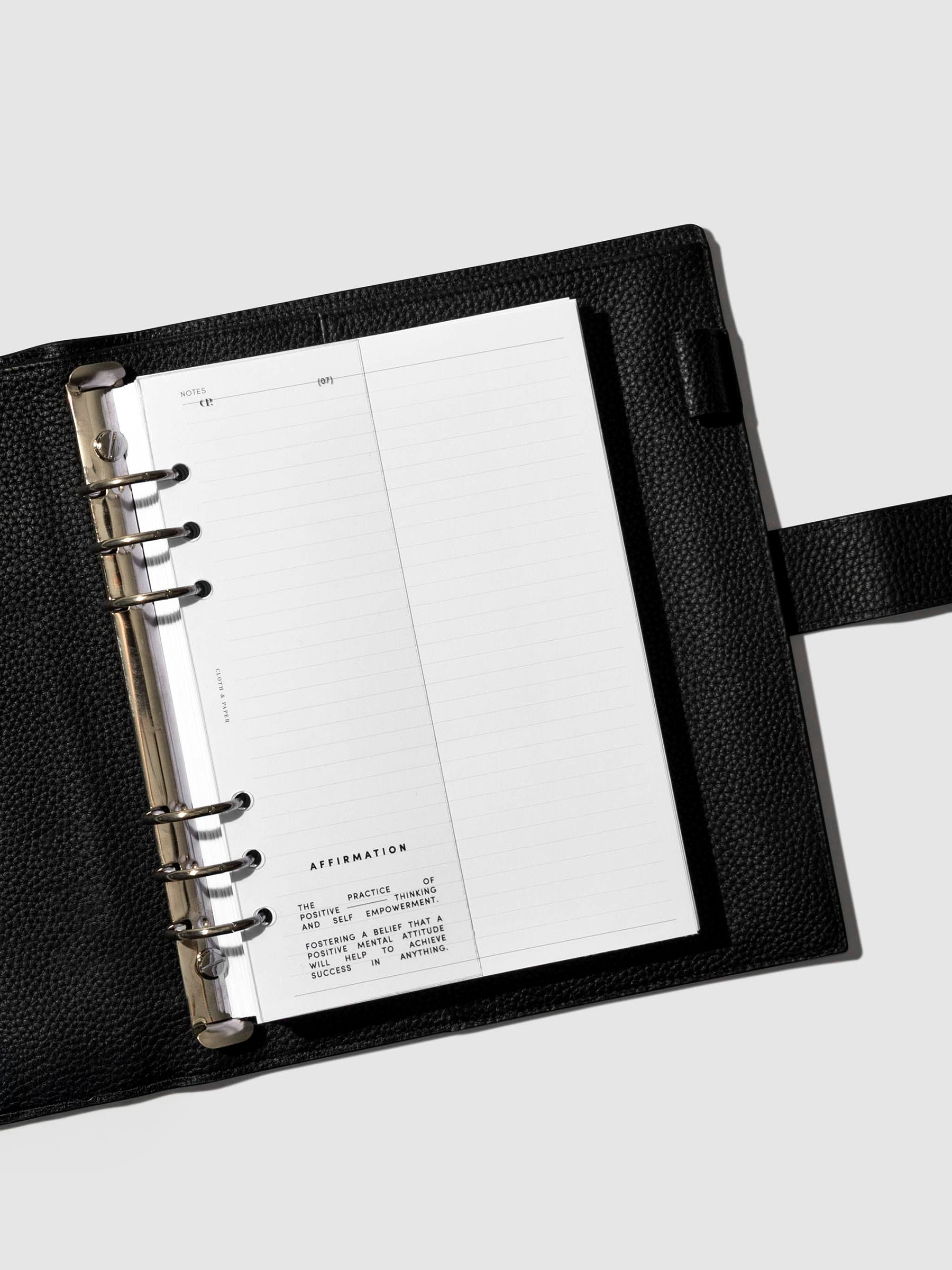 Dashboard in use inside a black leather planner.