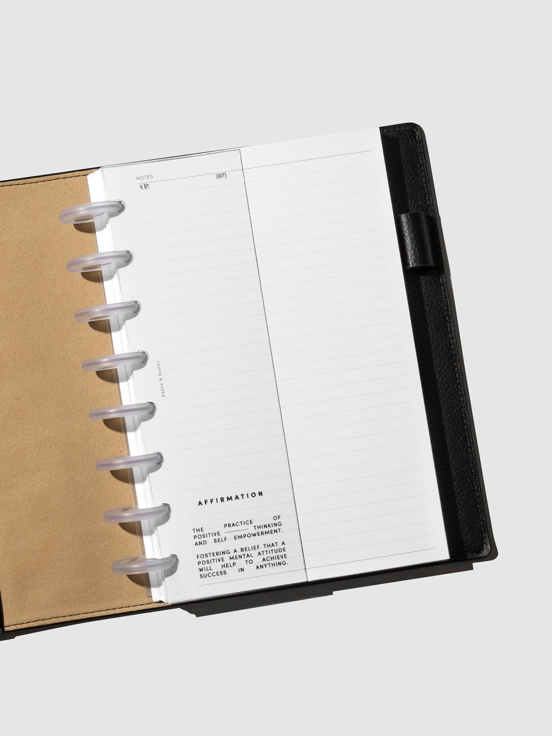 Dashboard in use inside a black leather planner.