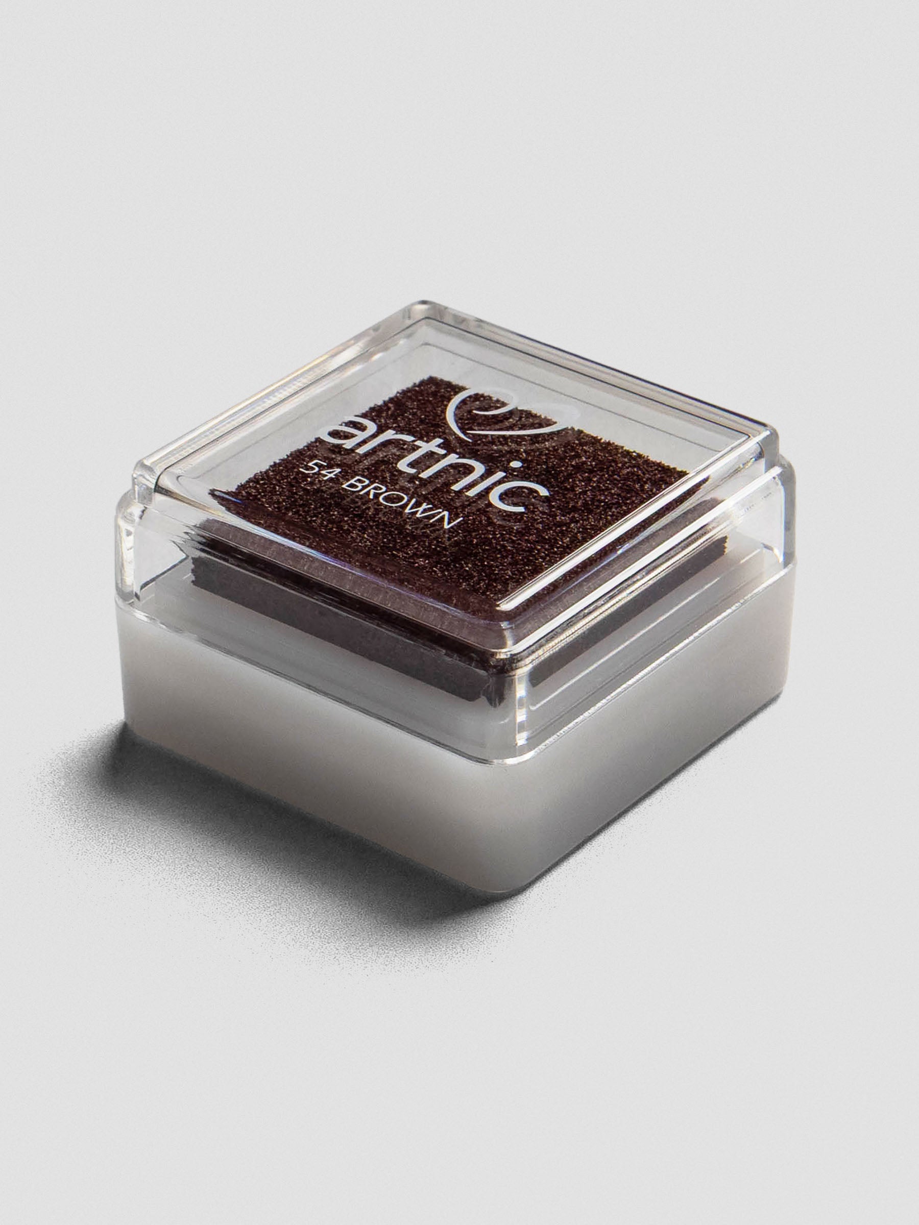Angled side view of a closed Artnic stamp ink pad in brown, showing the stackable clear lid and white base.