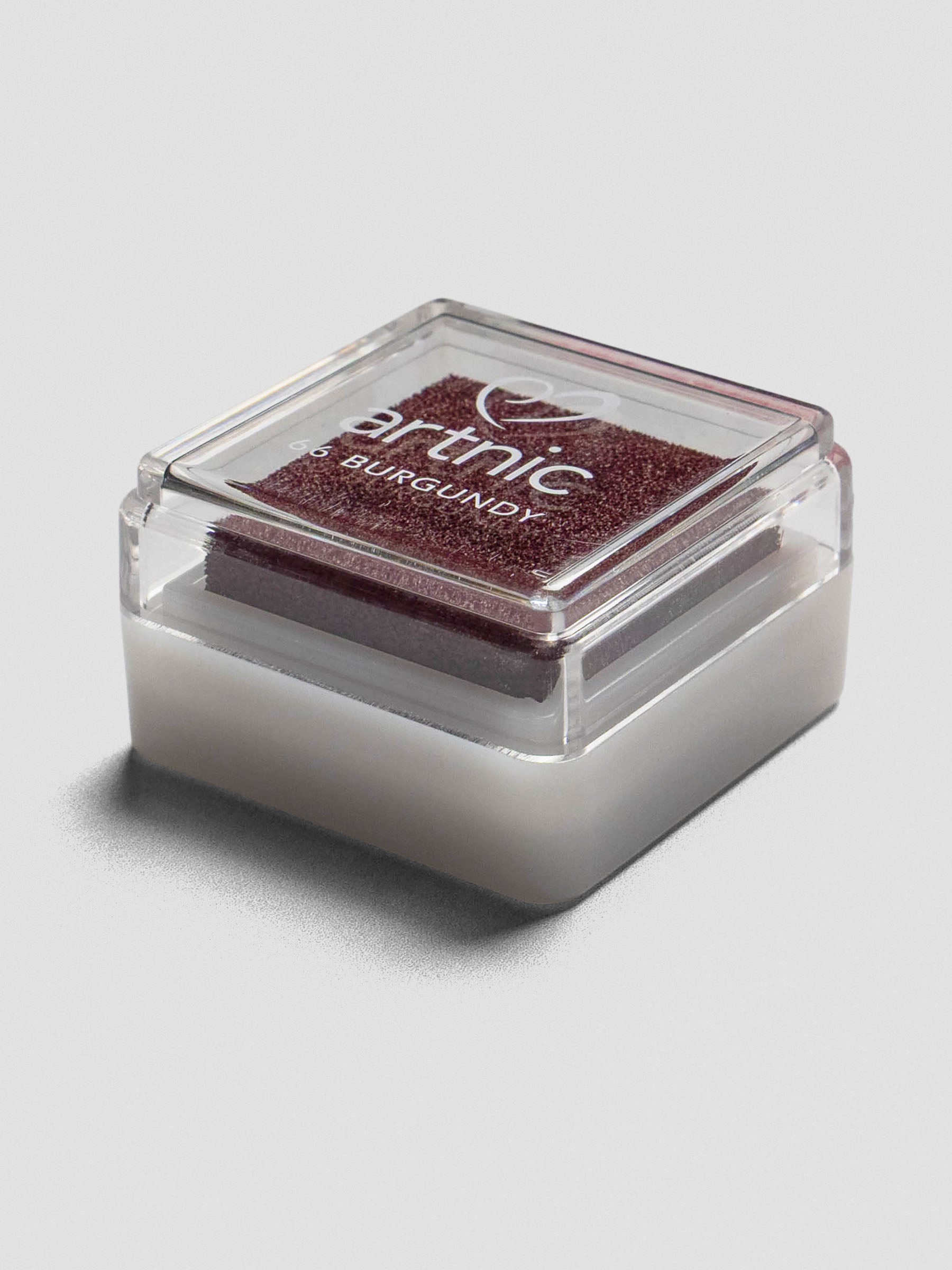 Burgundy Artnic ink pad with clear lid, angled view showing its stackable design.
