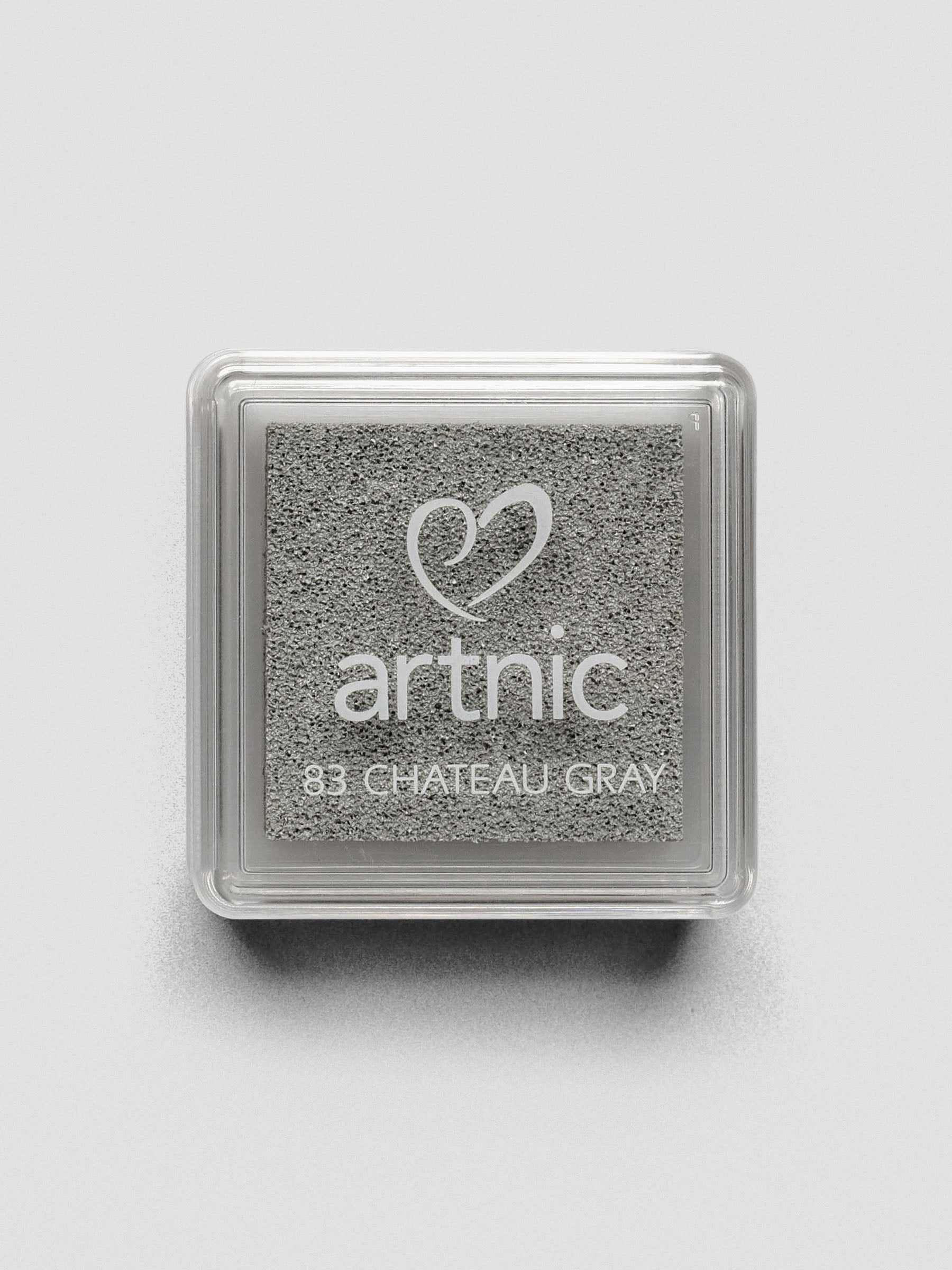 Square gray Artnic ink pad with clear lid labeled “83 Chateau Gray,” viewed from above.