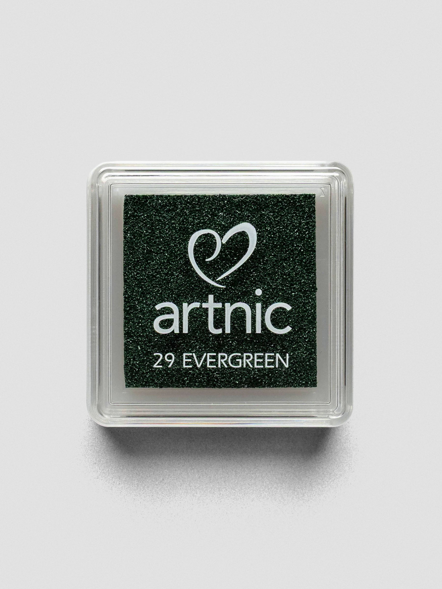 Square Artnic stamp ink pad in deep green color labeled “29 Evergreen,” with clear lid and white logo.