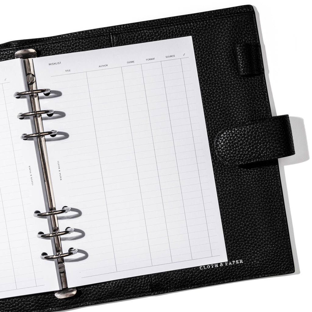Insert in use inside a black leather planner. Page shown is the wishlist.