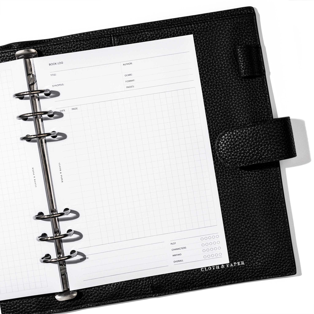 Insert in use inside a black leather planner. Page shown is the book log.