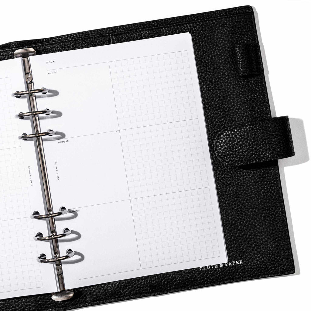 Insert in use inside a black leather planner. Page shown is the reading index.
