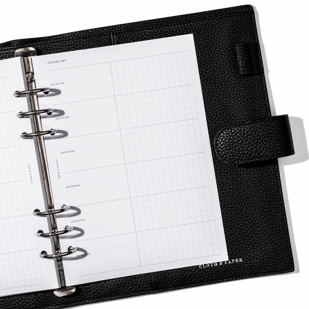 Insert in use inside a black leather planner. Page shown is the vocabulary list.