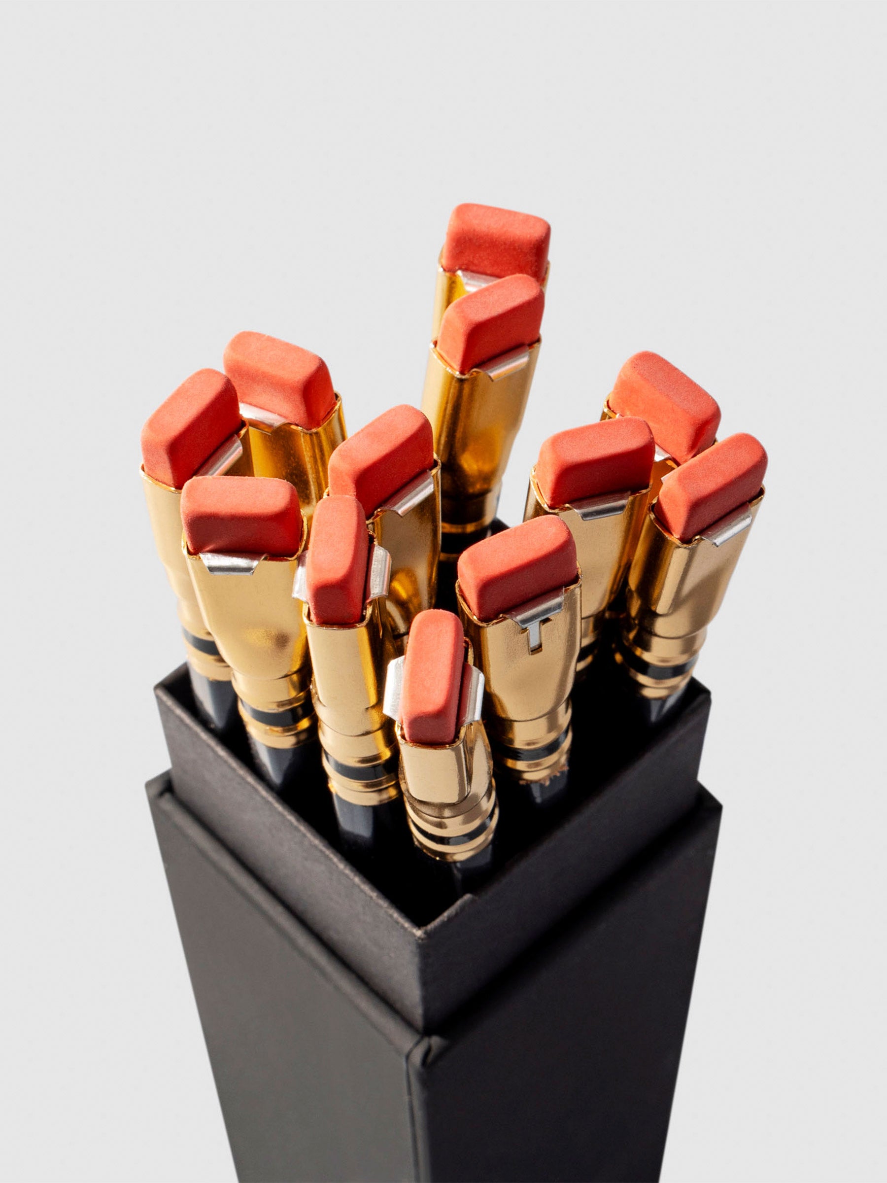 Set of 12 pencils displayed eraser side up inside the pencil packaging.
