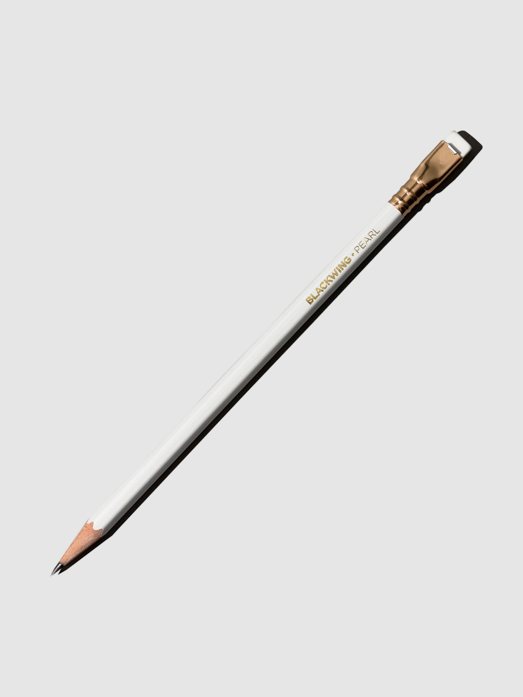 The image shows the blackwing pearl pencil. It features a white pencil with a matching tapered eraser set in gold.