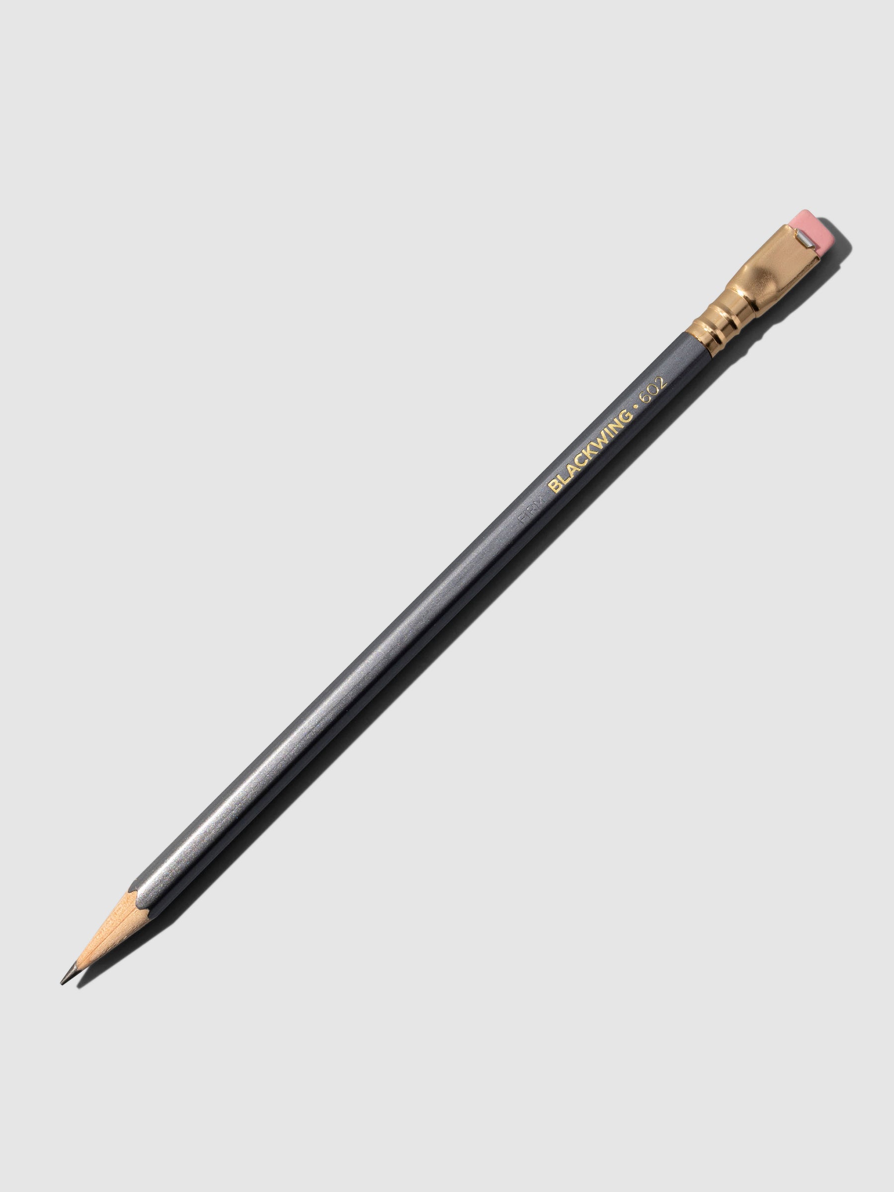 Black wooden pencil displayed on a neutral background.