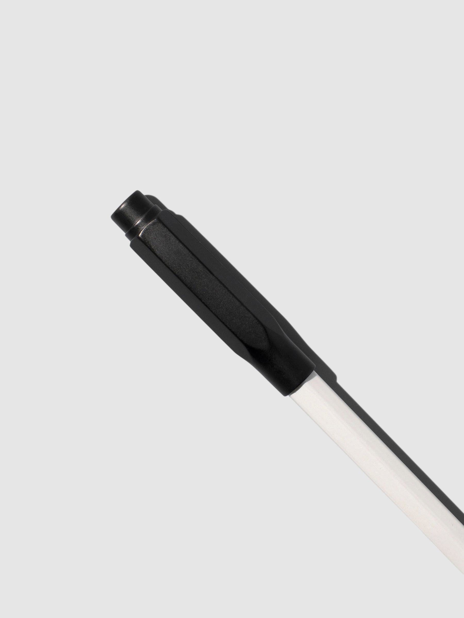 Point guard attached to a white pencil on a neutral background.