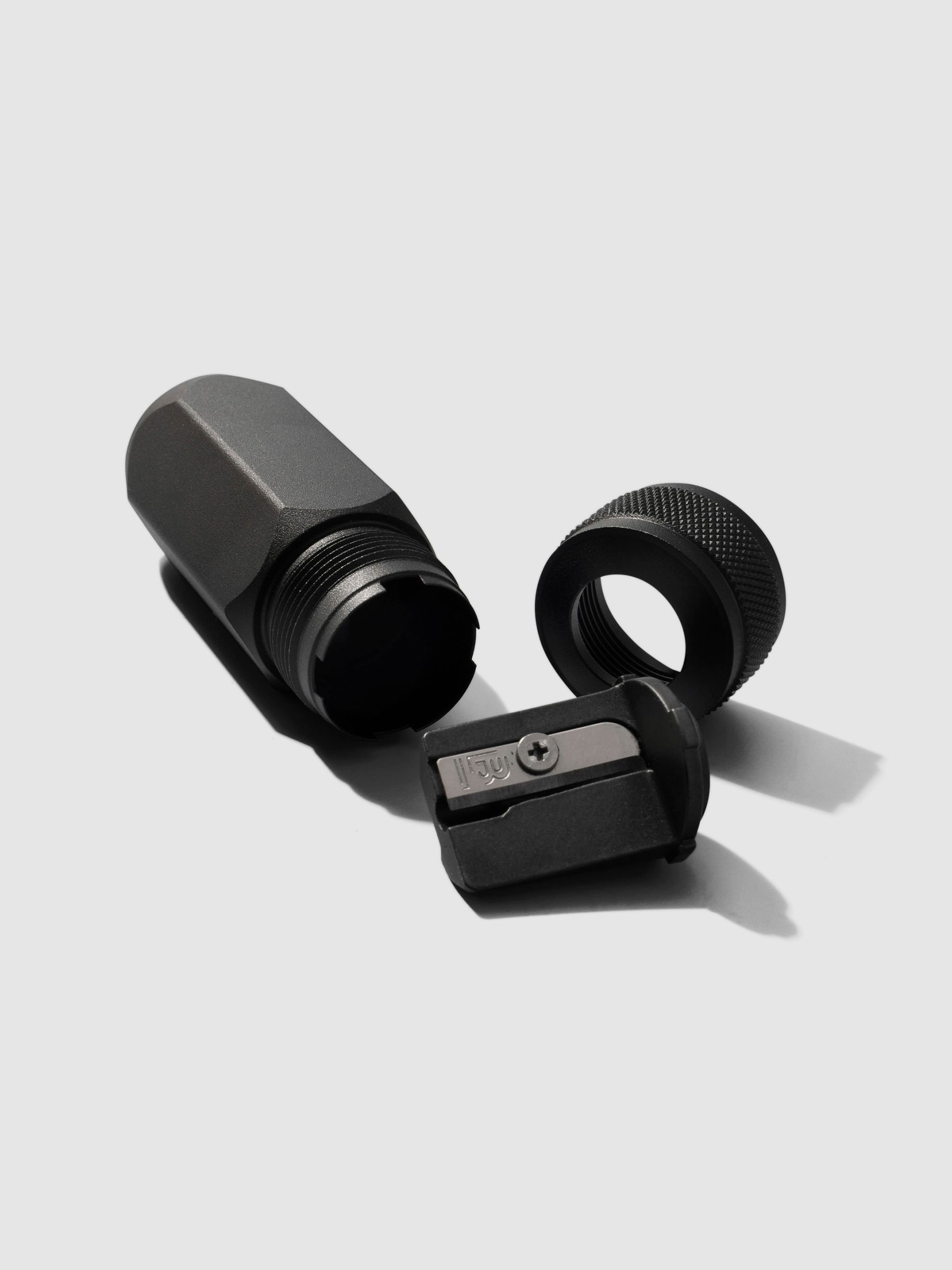 Sharpener shown disassembled on a neutral background.