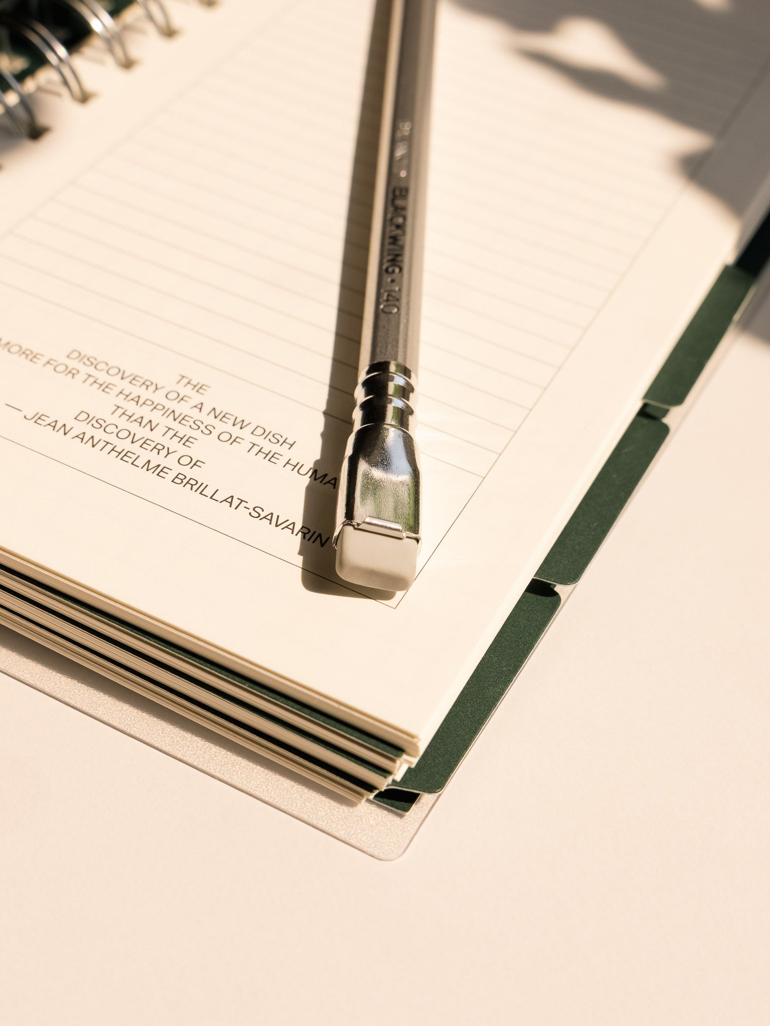 Close-up of the eraser end of a Blackwing 140 pencil on a lined planner page, with visible “Blackwing 140” branding.