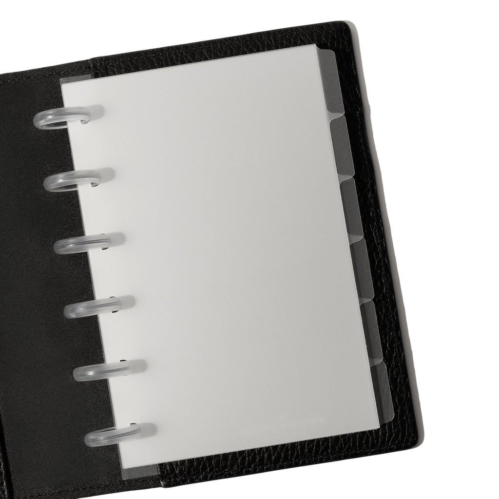 CP Petite Blank side tabs shown in use inside a black leather planner.