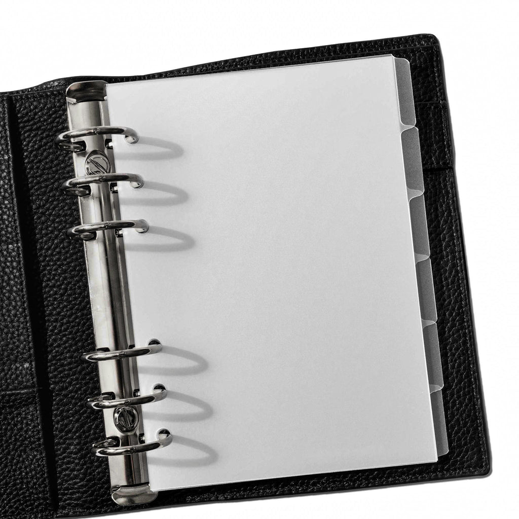 Personal Wide Blank side tabs shown in use inside a black leather planner.