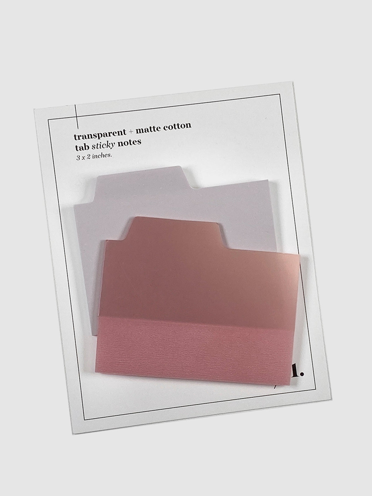 Blank Tab Sticky Note Set, Cotton, Cloth and Paper. Sticky note set displayed against a neutral background. The matte sticky note pad is attached to the sticky note backing, while the transparent sticky note pad is layered on top of it, turned slightly to the right.