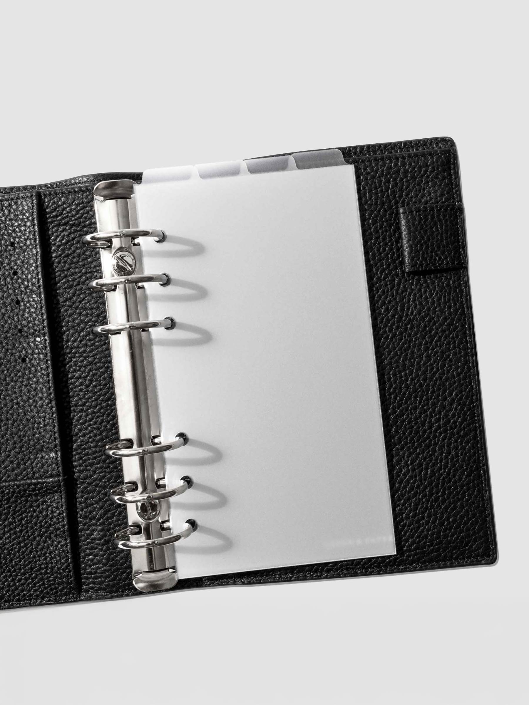 Personal Dividers in use inside a black leather planner.