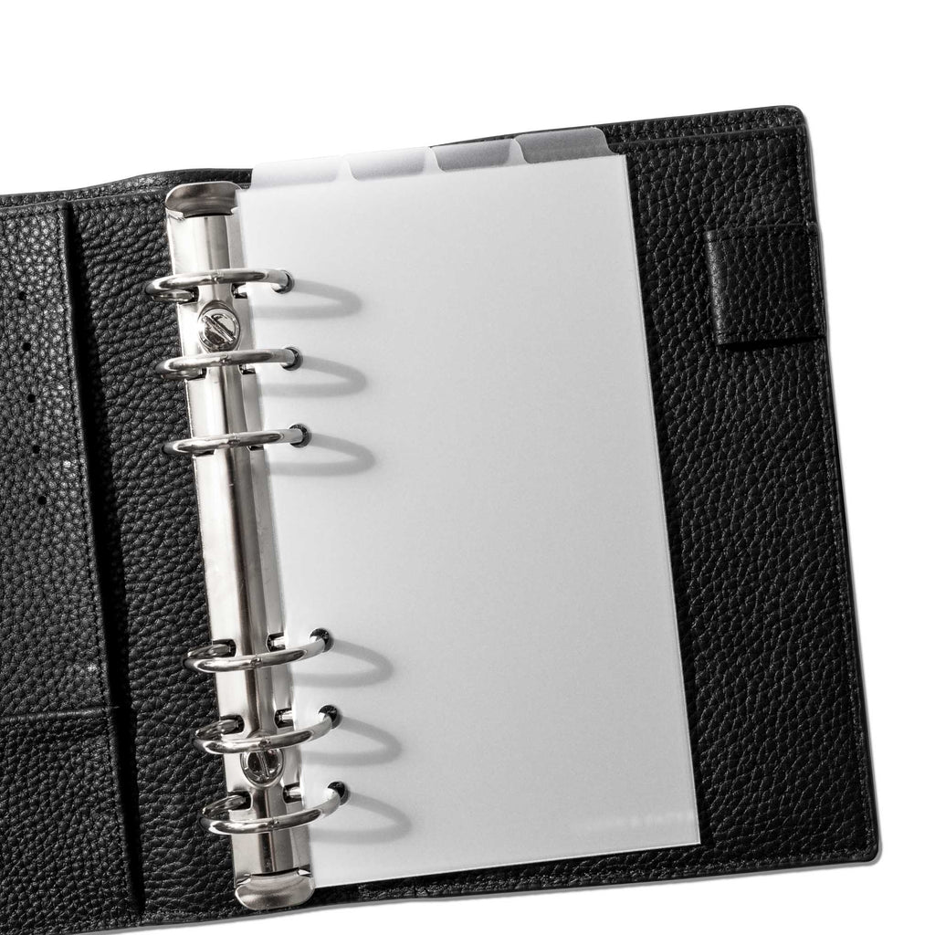 Personal Dividers in use inside a black leather planner.