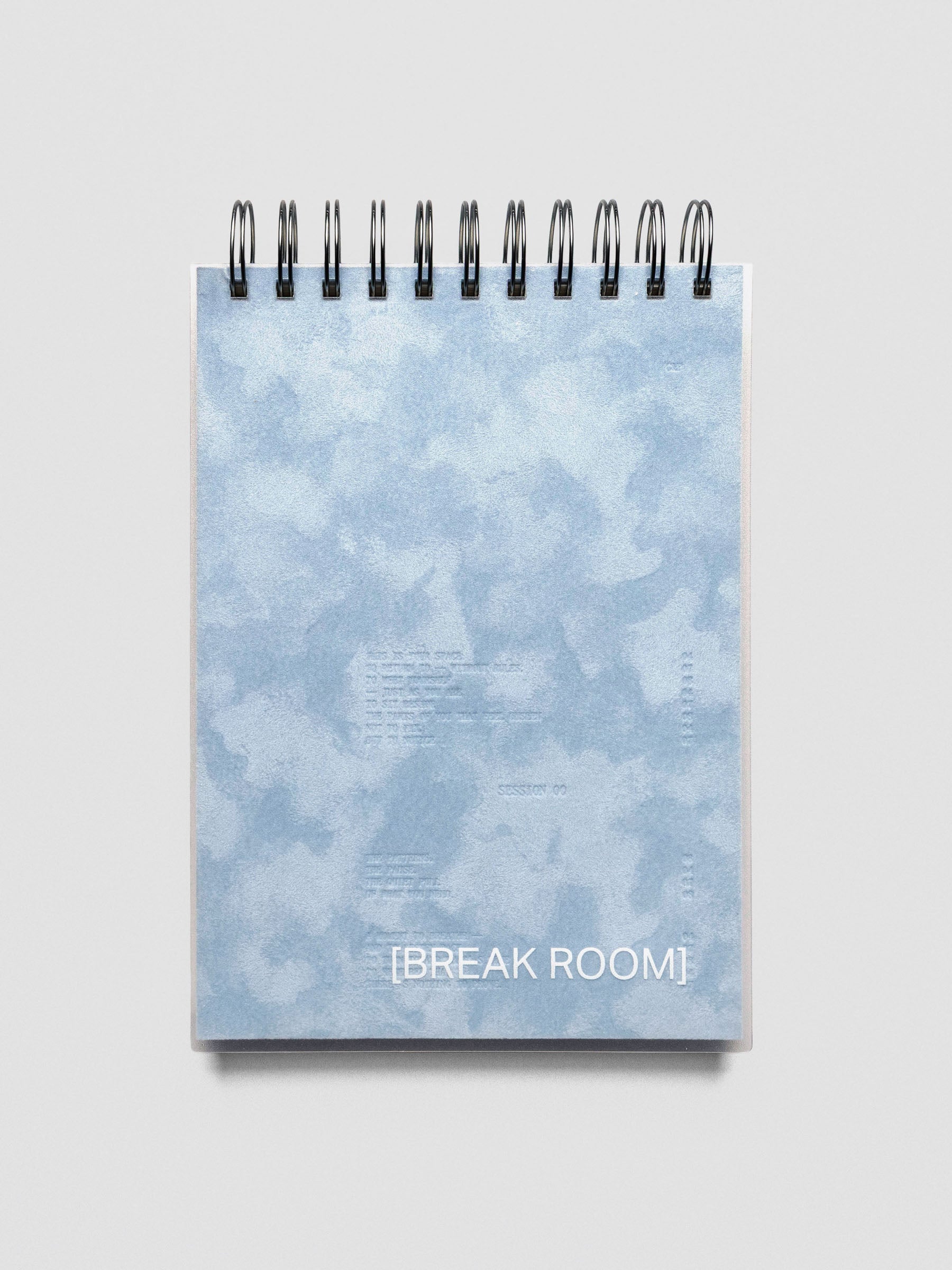 A velvet blue top spiral notebook with text design reading "Break Room".