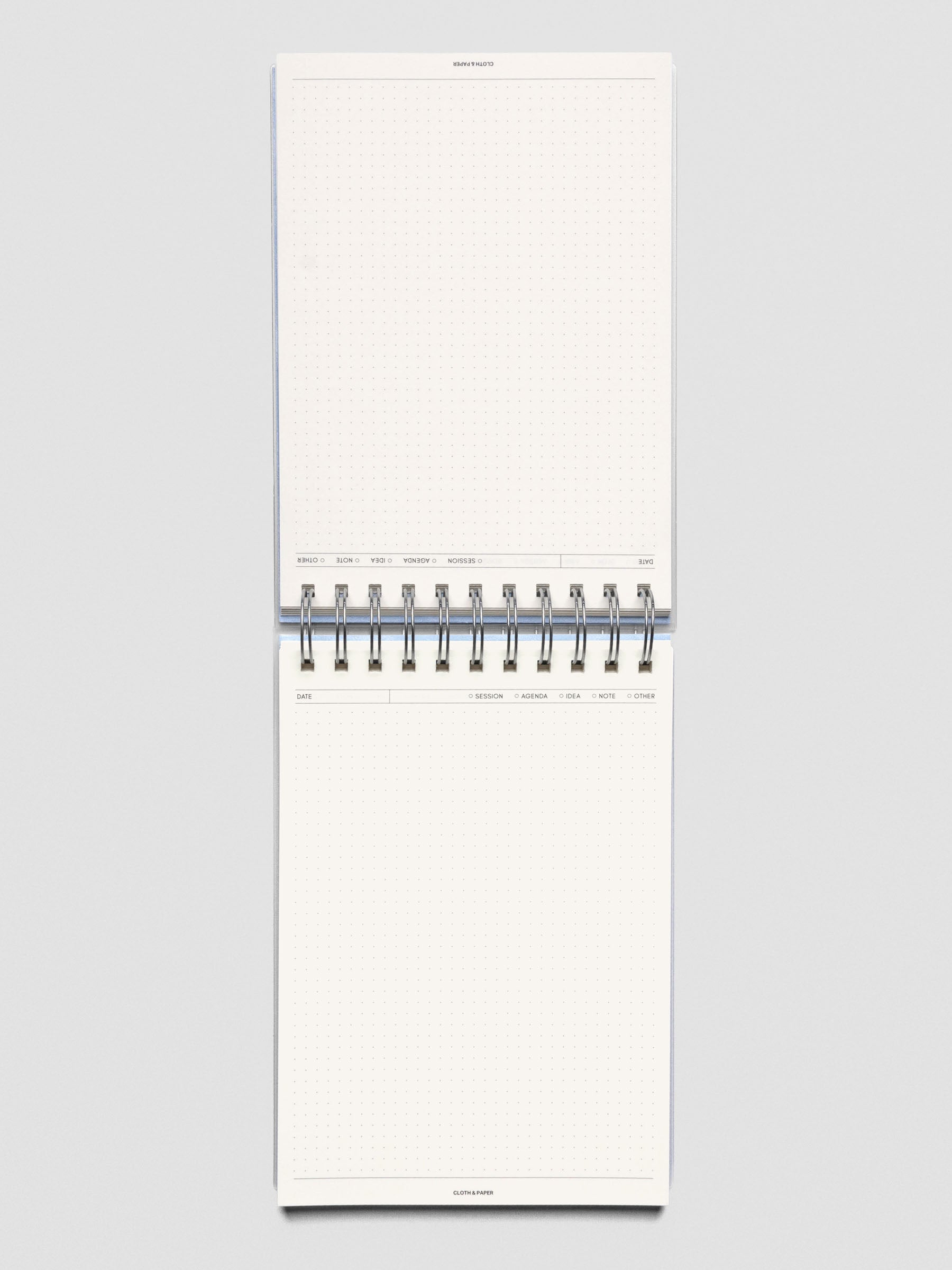 Break Room top spiral notebook shown open to reveal pages with headers and graph pages.