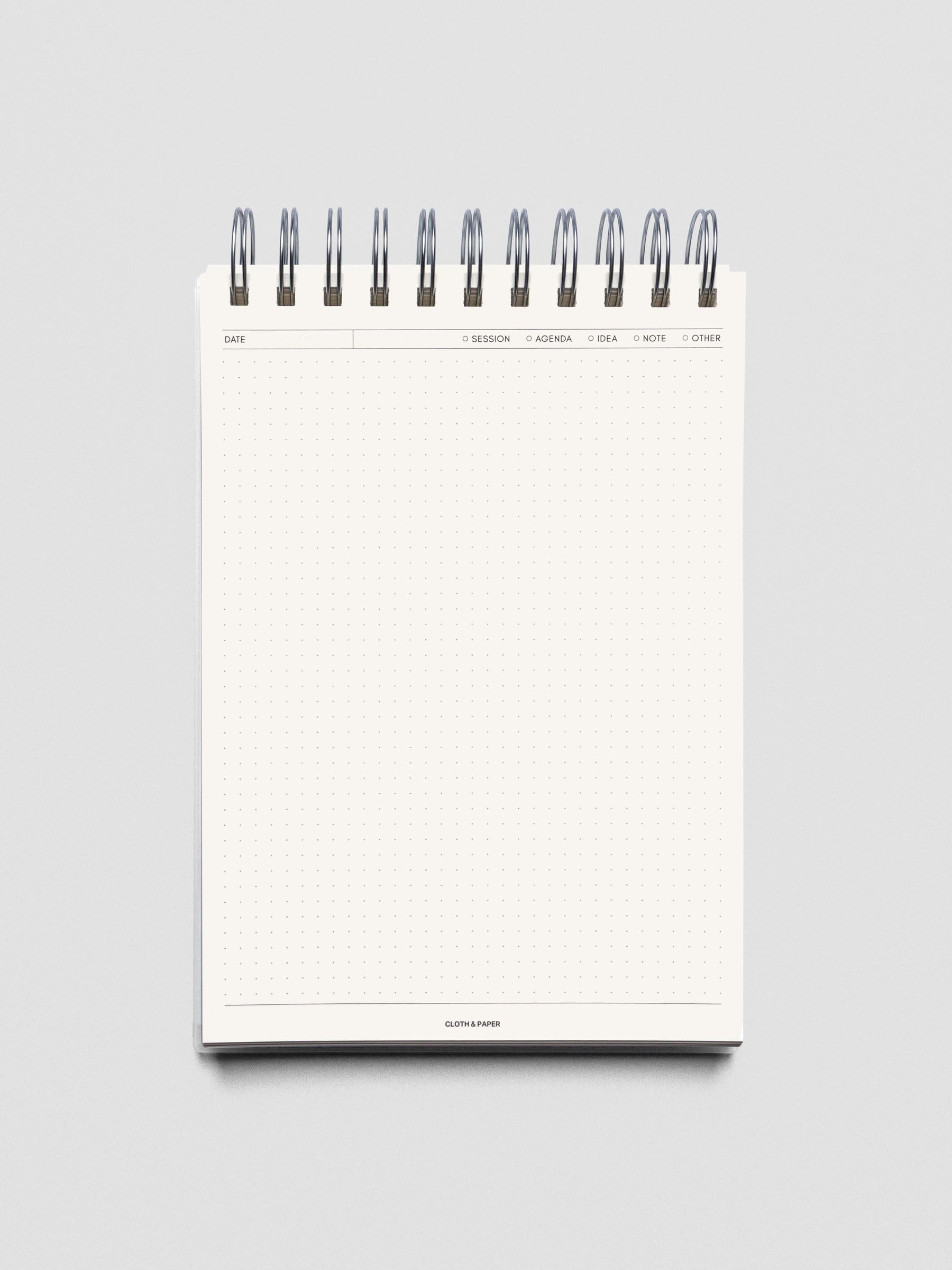 Break Room notebook shown open and folded over displaying an empty page.