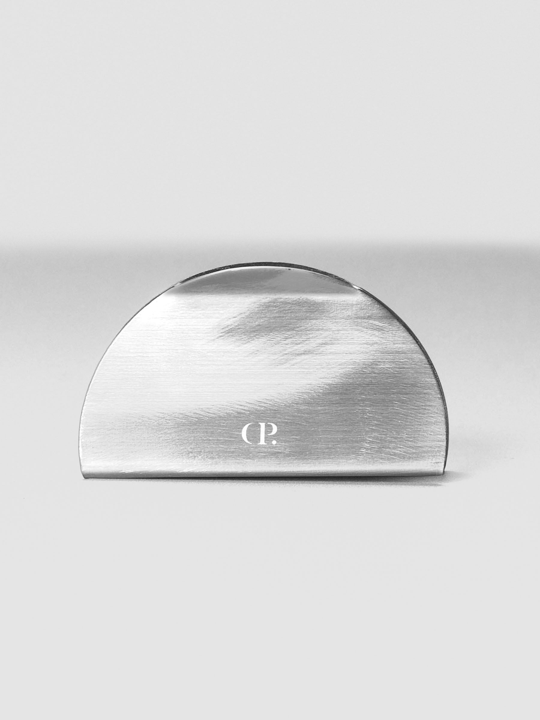 Shiny metal clip stand with CP logo shown standing from the front.