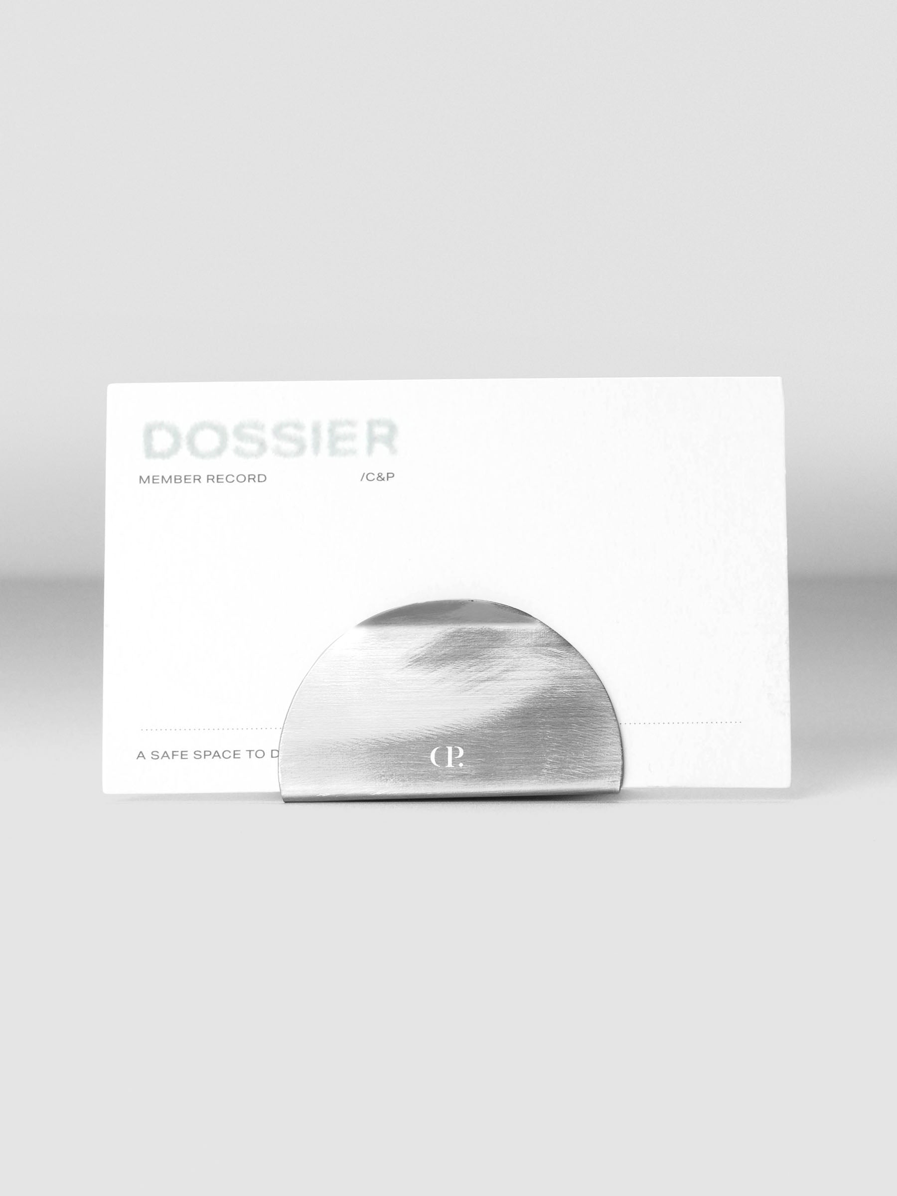 Metal clip stand shown standing from the front with a journaling card inserted.