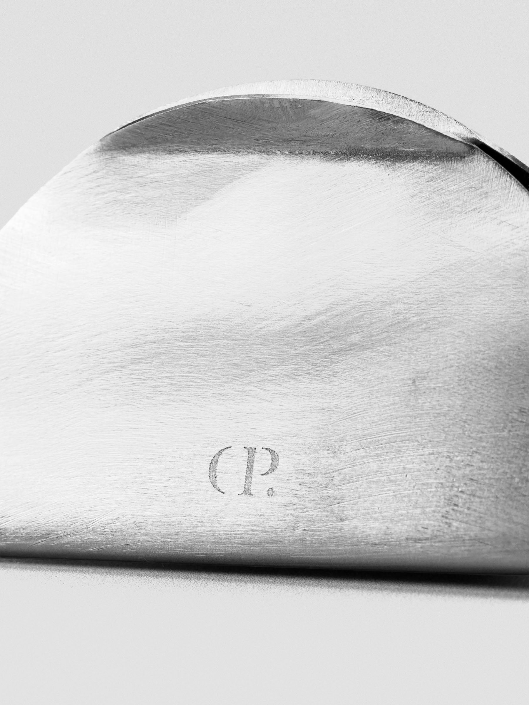 Close up of the metal clip stand, highlighting the CP logo.