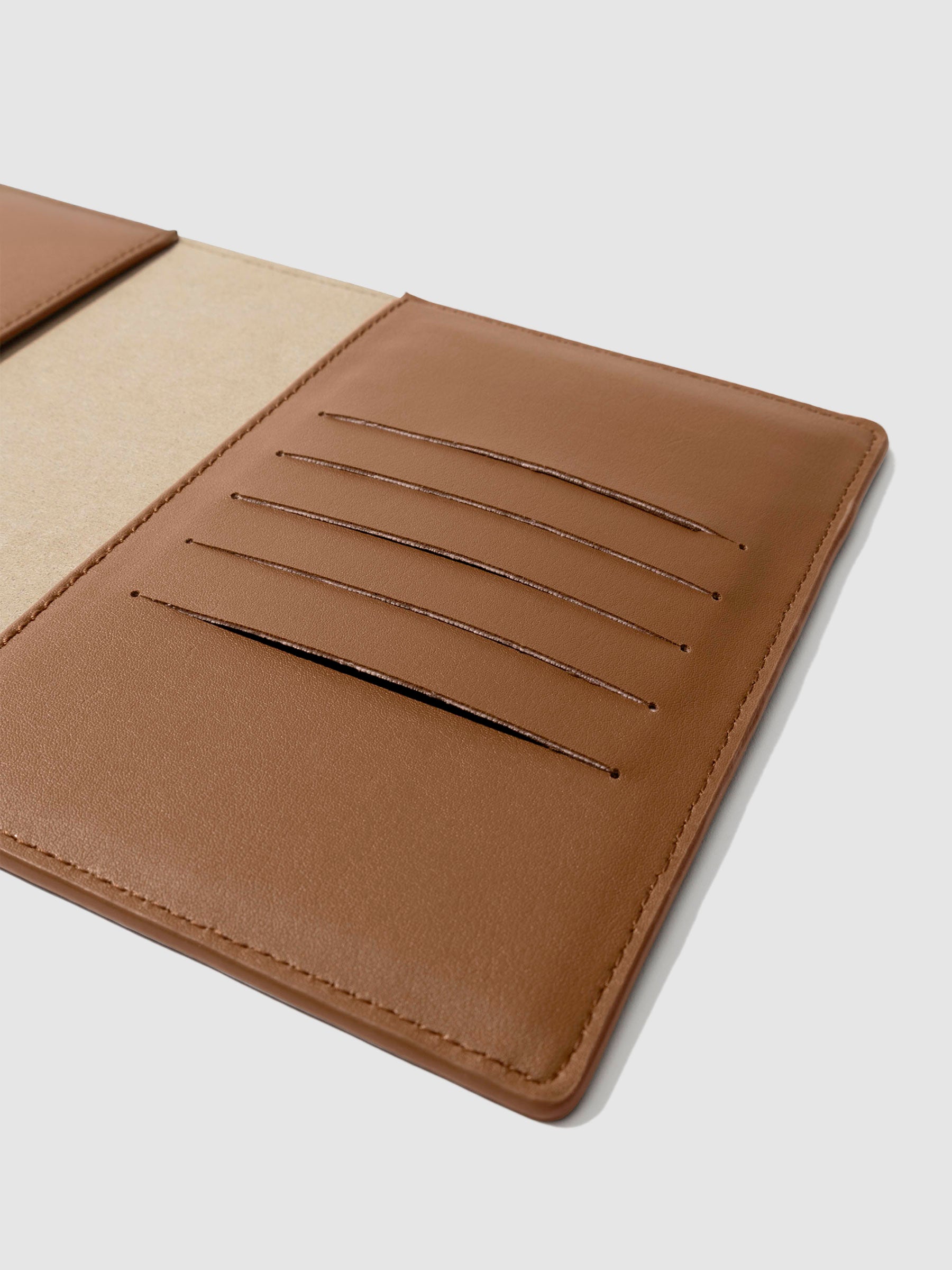 Closeup of folio's credit card slots. Color pictured is clay brown. 