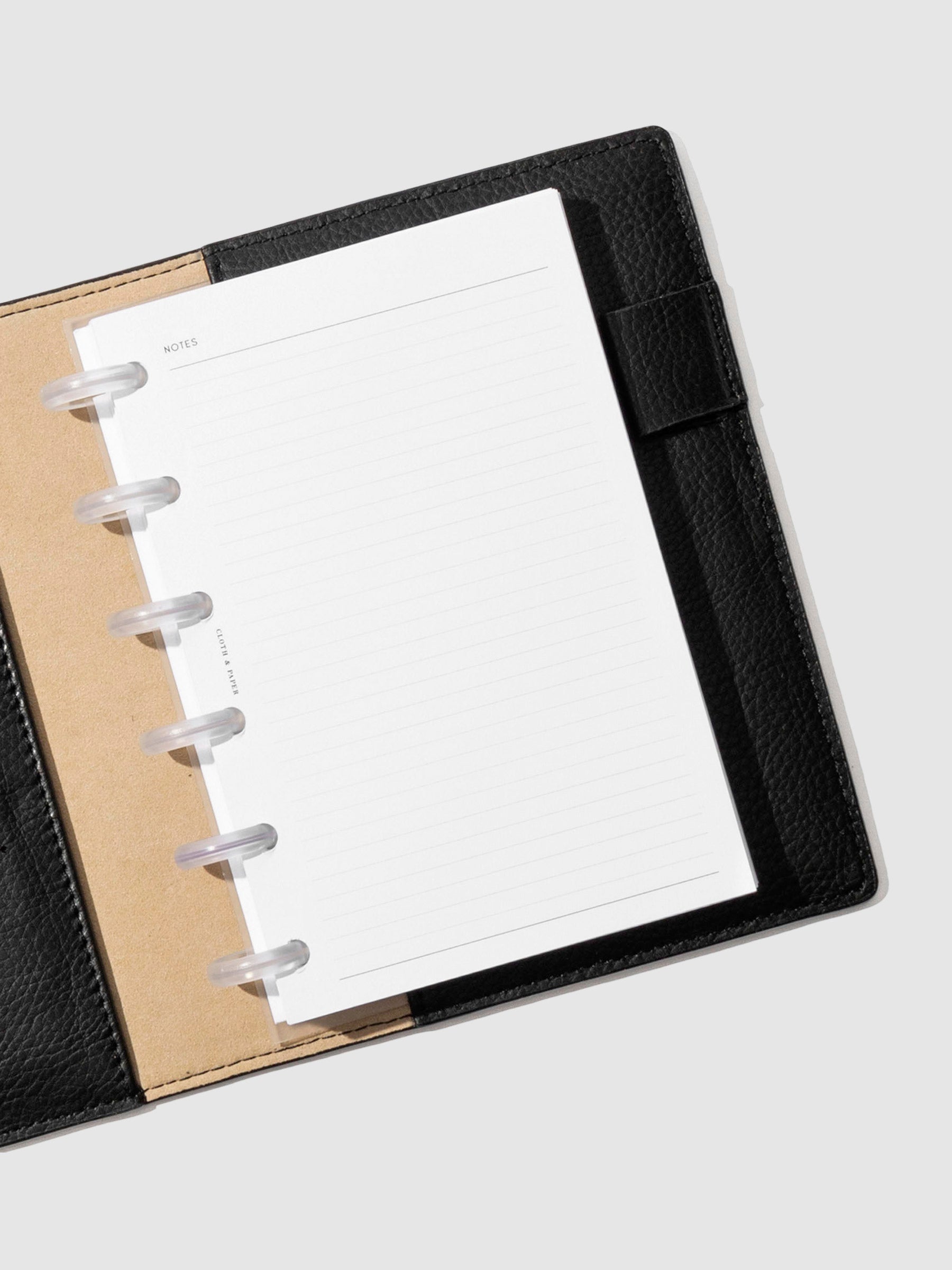 CP Petite folio displayed opened on a neutral background. Color shown is mesa black.