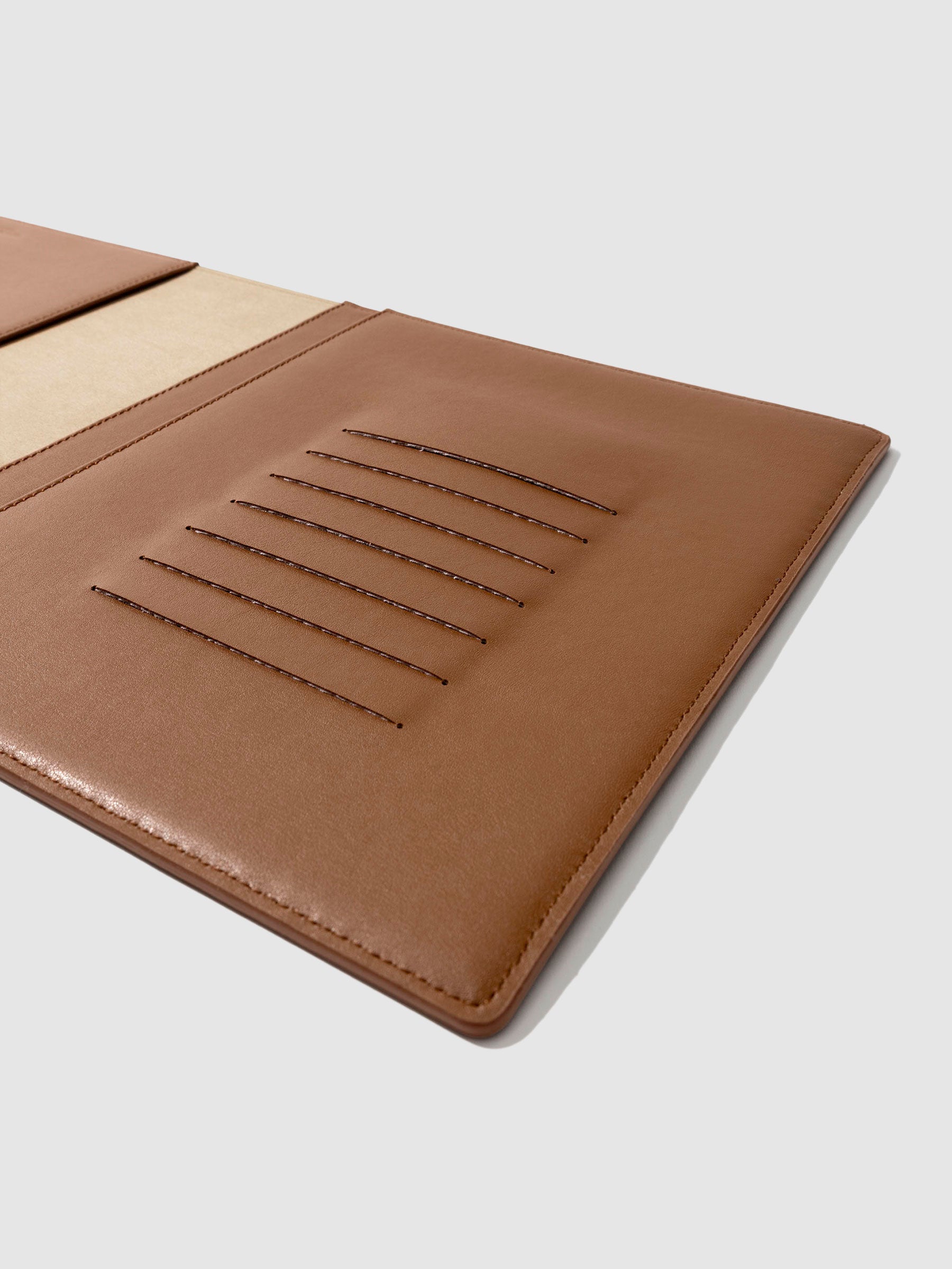 Closeup of folio's credit card slots. Color pictured is clay brown.