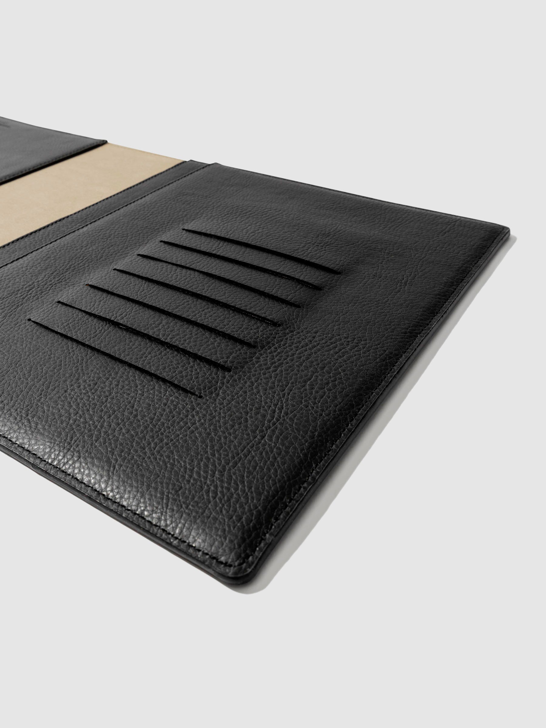 Closeup of folio's credit card slots. Color pictured is mesa black.