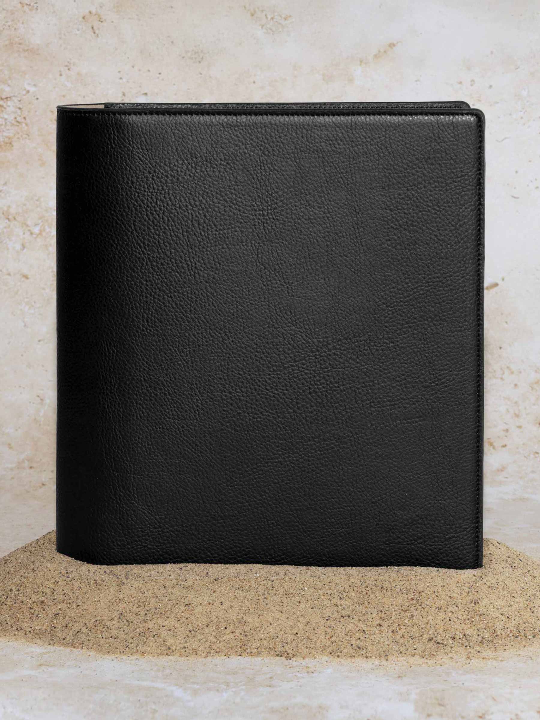 Cactus Vegan Leather Folio, HP Classic, Cloth and Paper. Folio displayed on a textured tan background, placed in a pile of sand. Color pictured is mesa black.