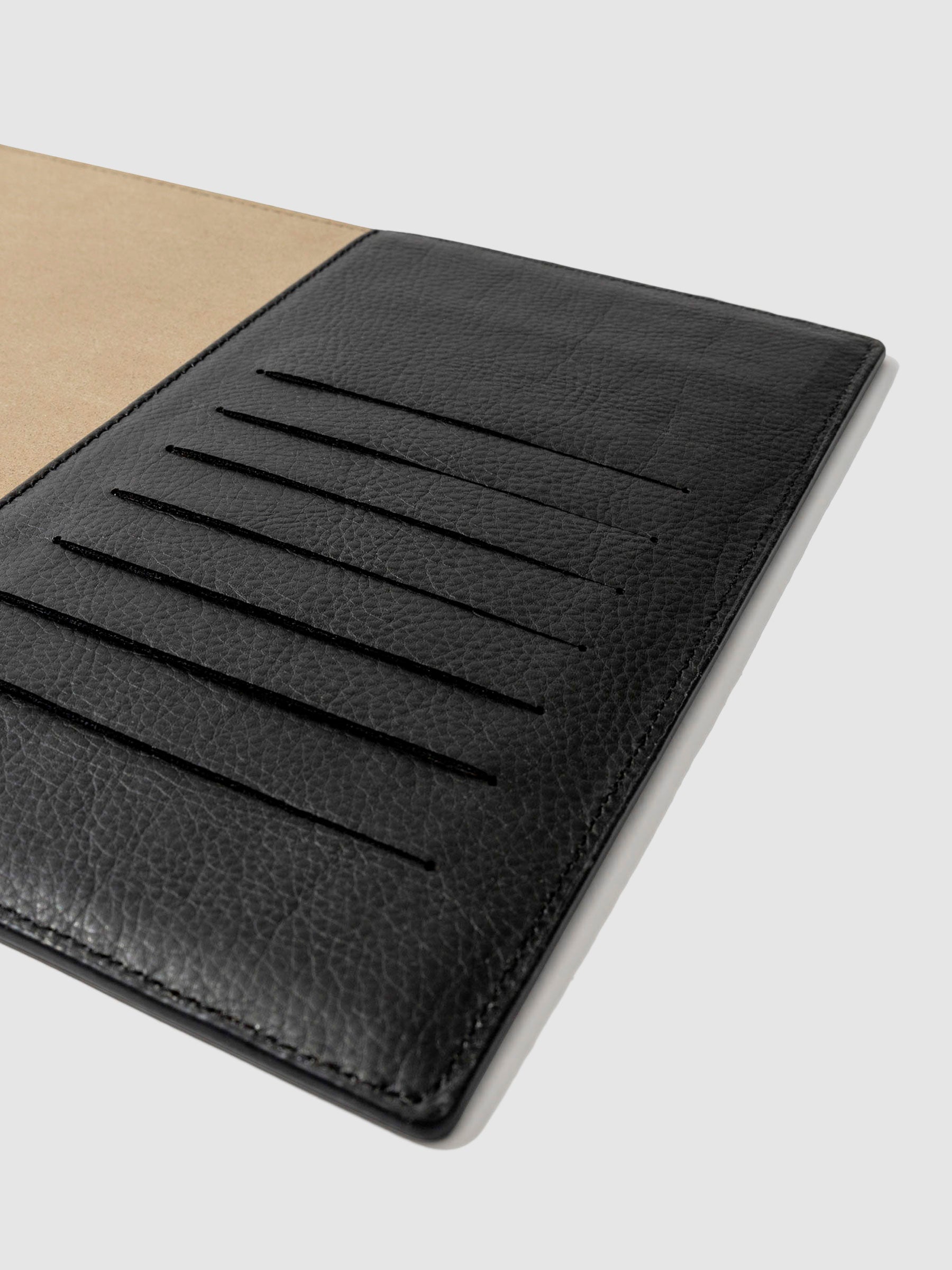 Closeup of folio's credit card slots. Color pictured is mesa black.