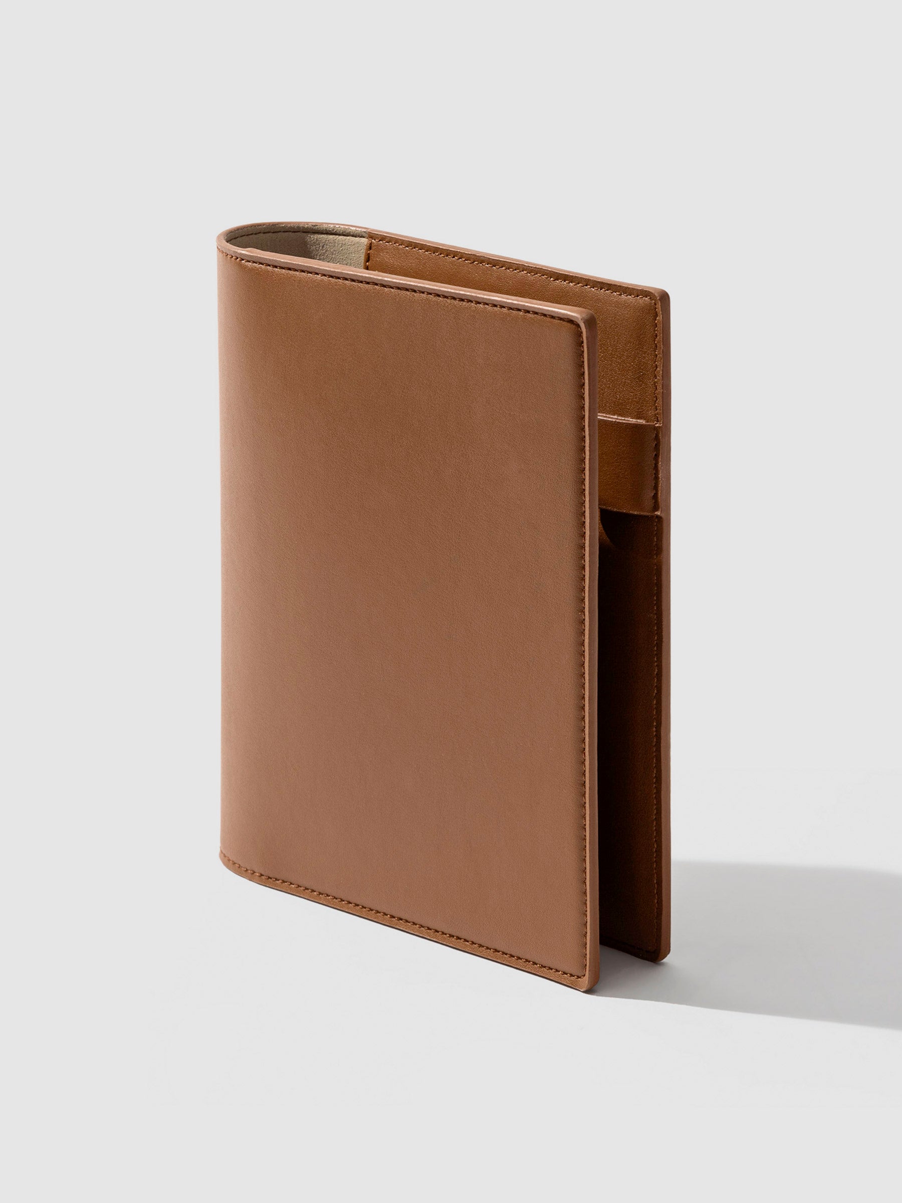 Folio displayed on a neutral background. Color shown is clay brown. 