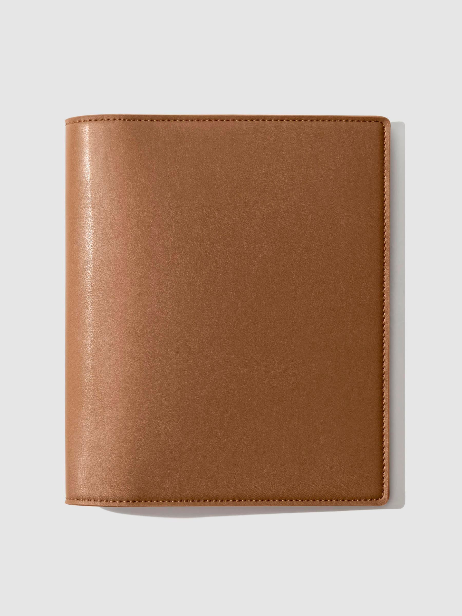 Folio displayed on a neutral background. Color shown is clay brown. 