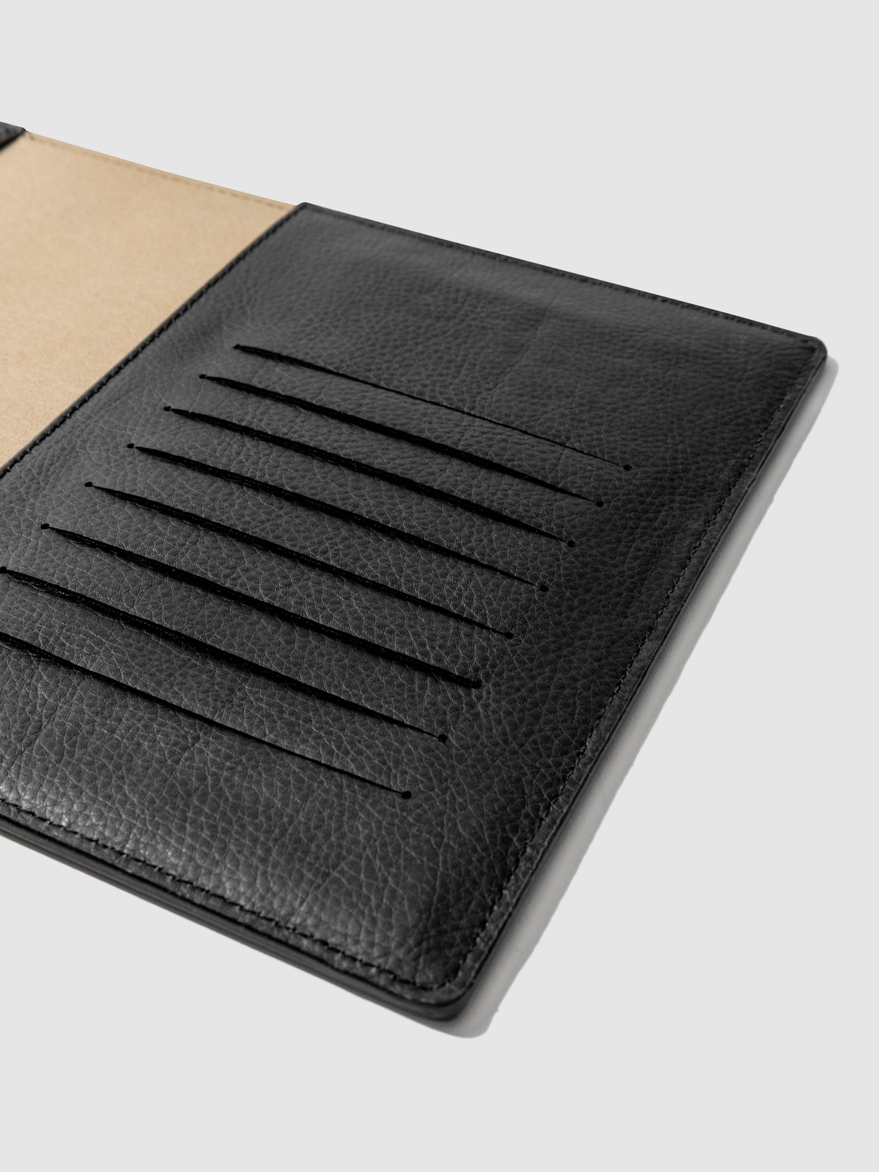 Closeup of folio's credit card slots. Color pictured is mesa black.