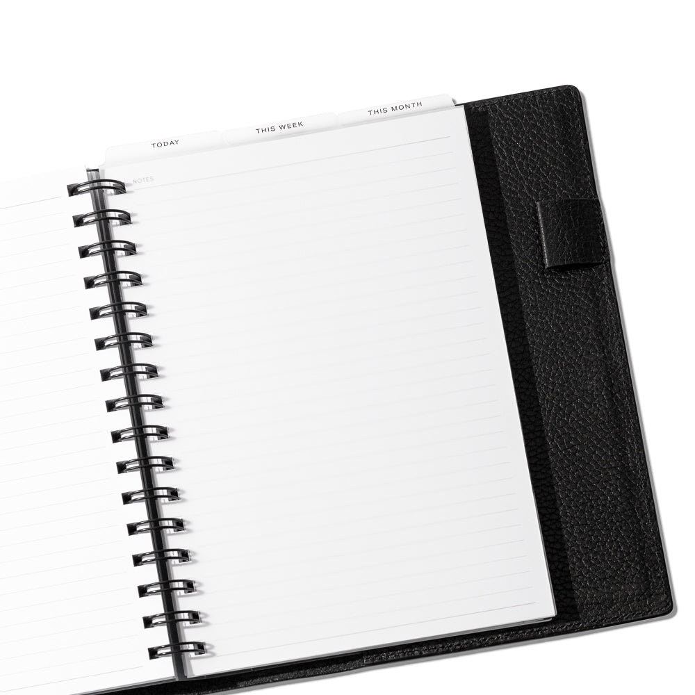 A5 Spiral Black Foil Cadence Tab Dividers displayed in a black leather planner.