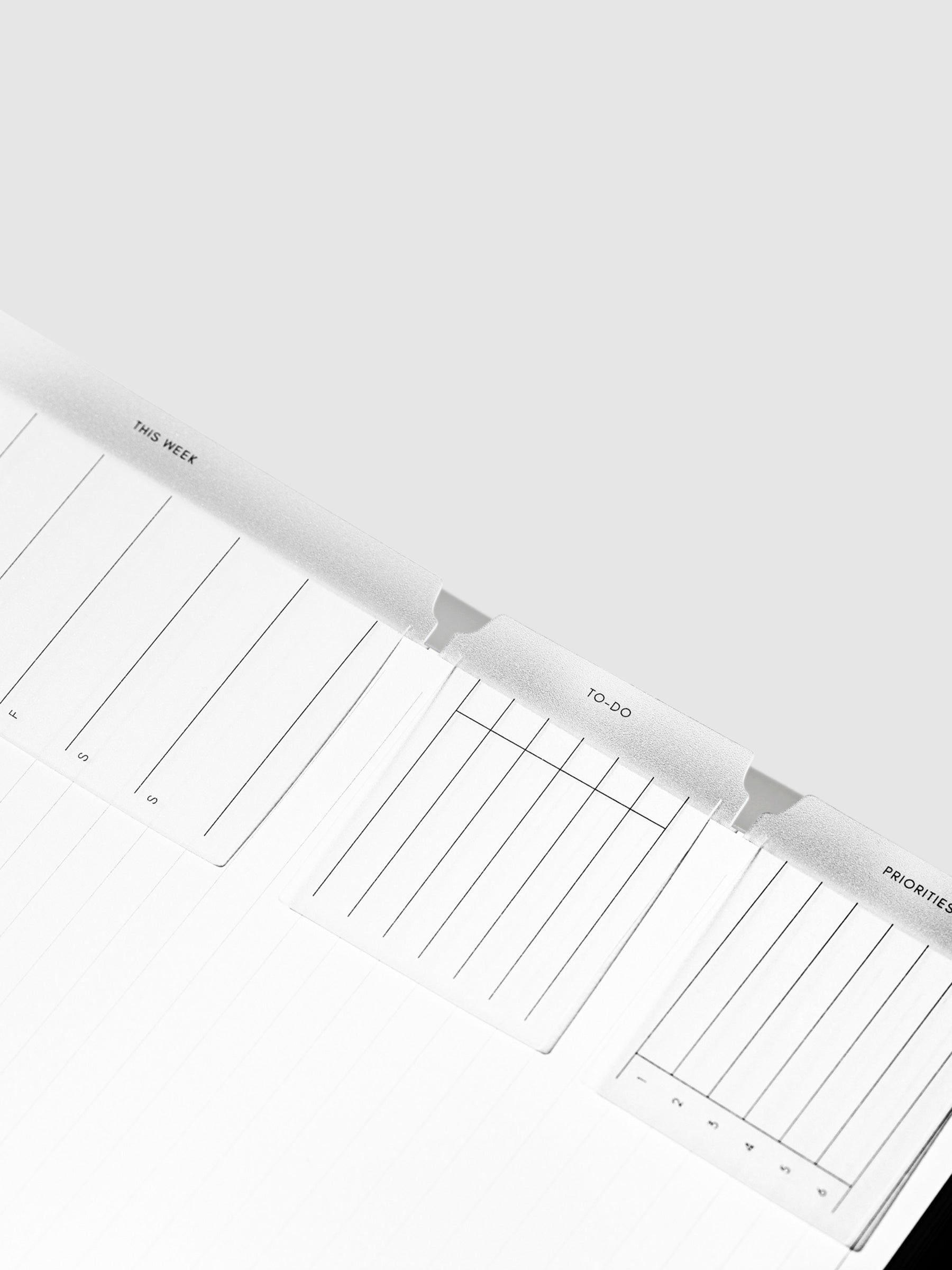 Set of three tabs shown inside a notebook.