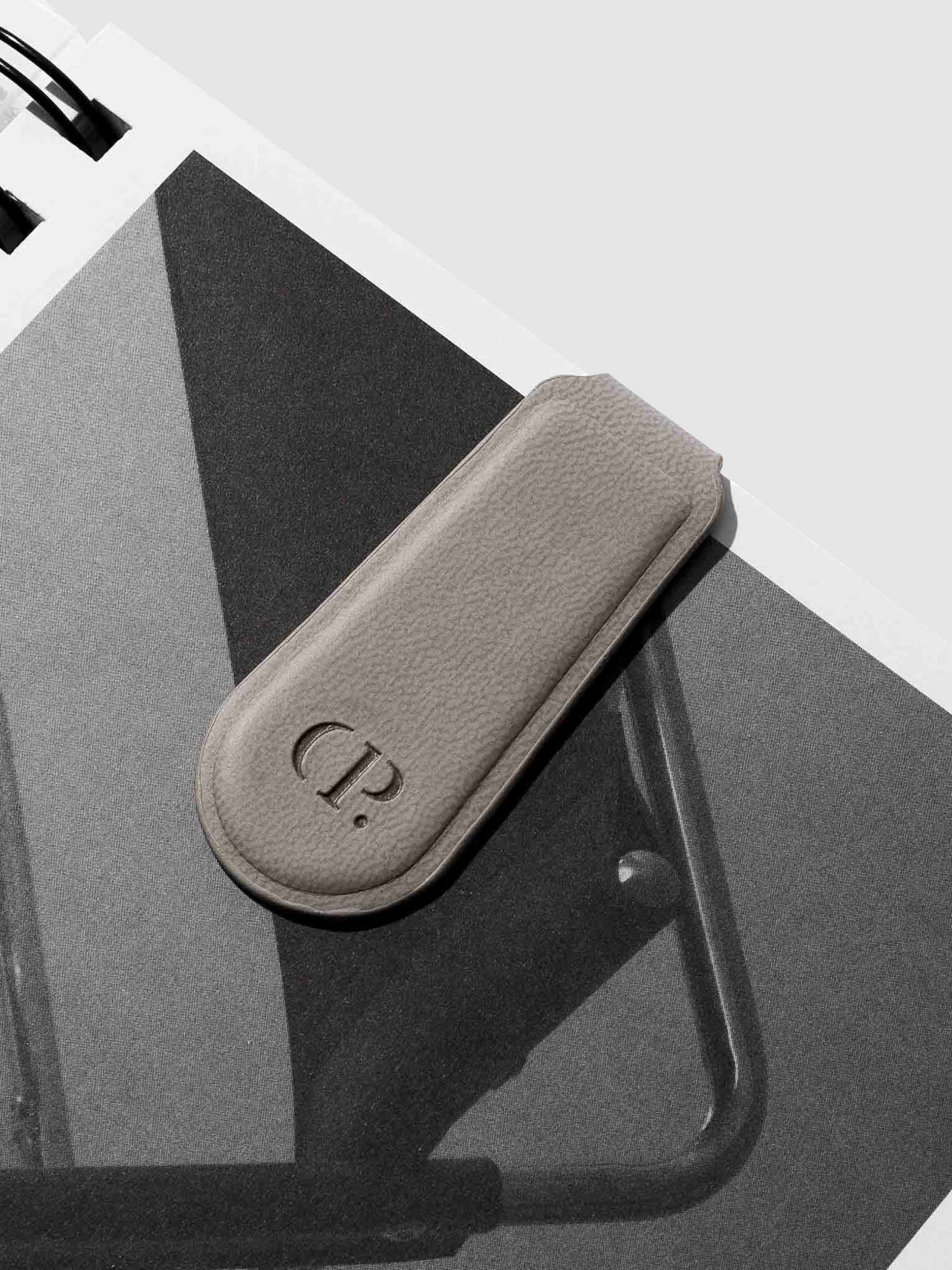 Close up of smooth leather texture on clip. Color shown is Ash.