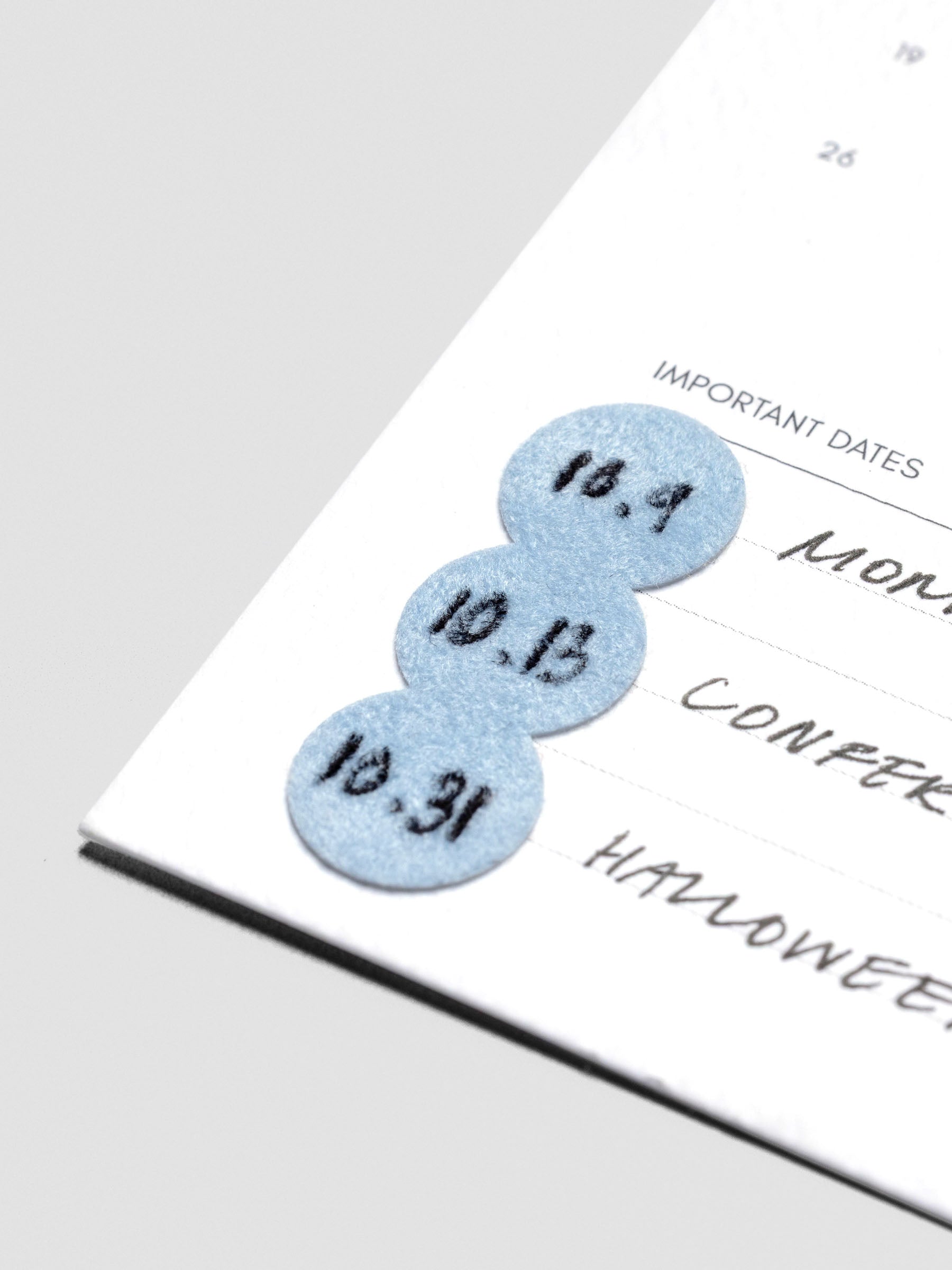 A close up of a planner insert with one medium sized Cloud Sticker in Velvet displaying their writability and texture.