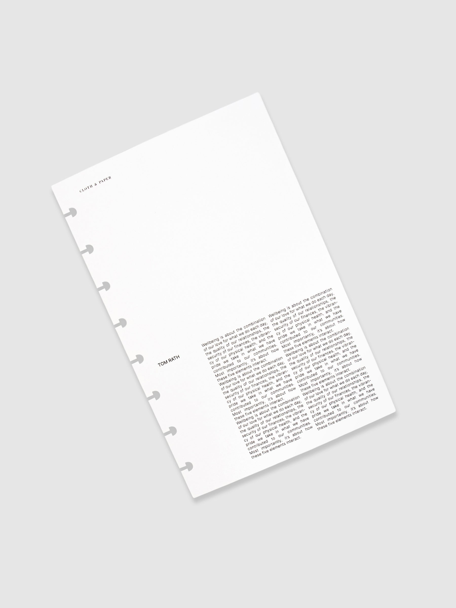 Dashboard turned upright to show the front with an editorial text design. The dashboard is turned to the left against a white background.