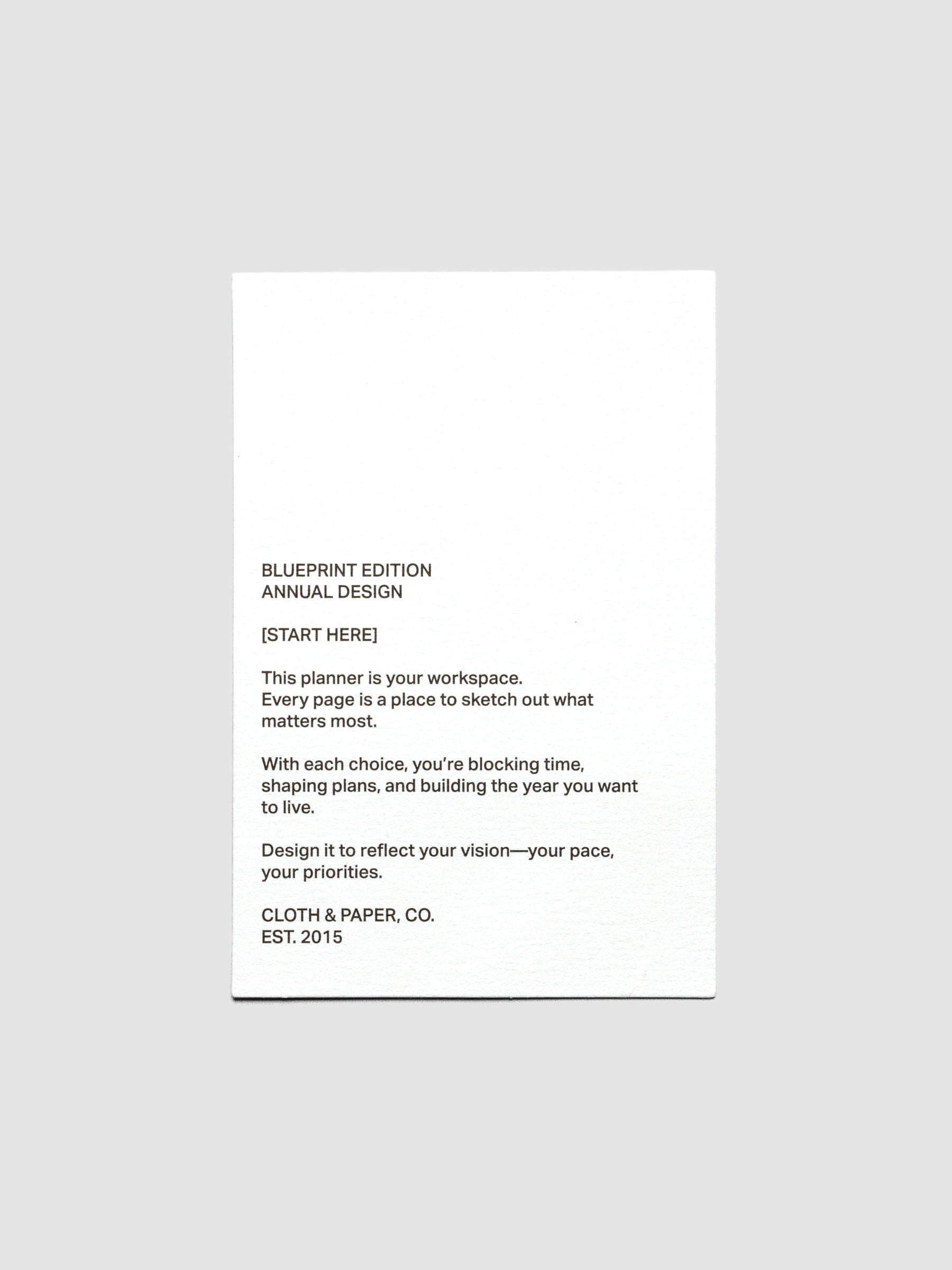 White paper journaling card with black text themed on a blueprint planning theme.