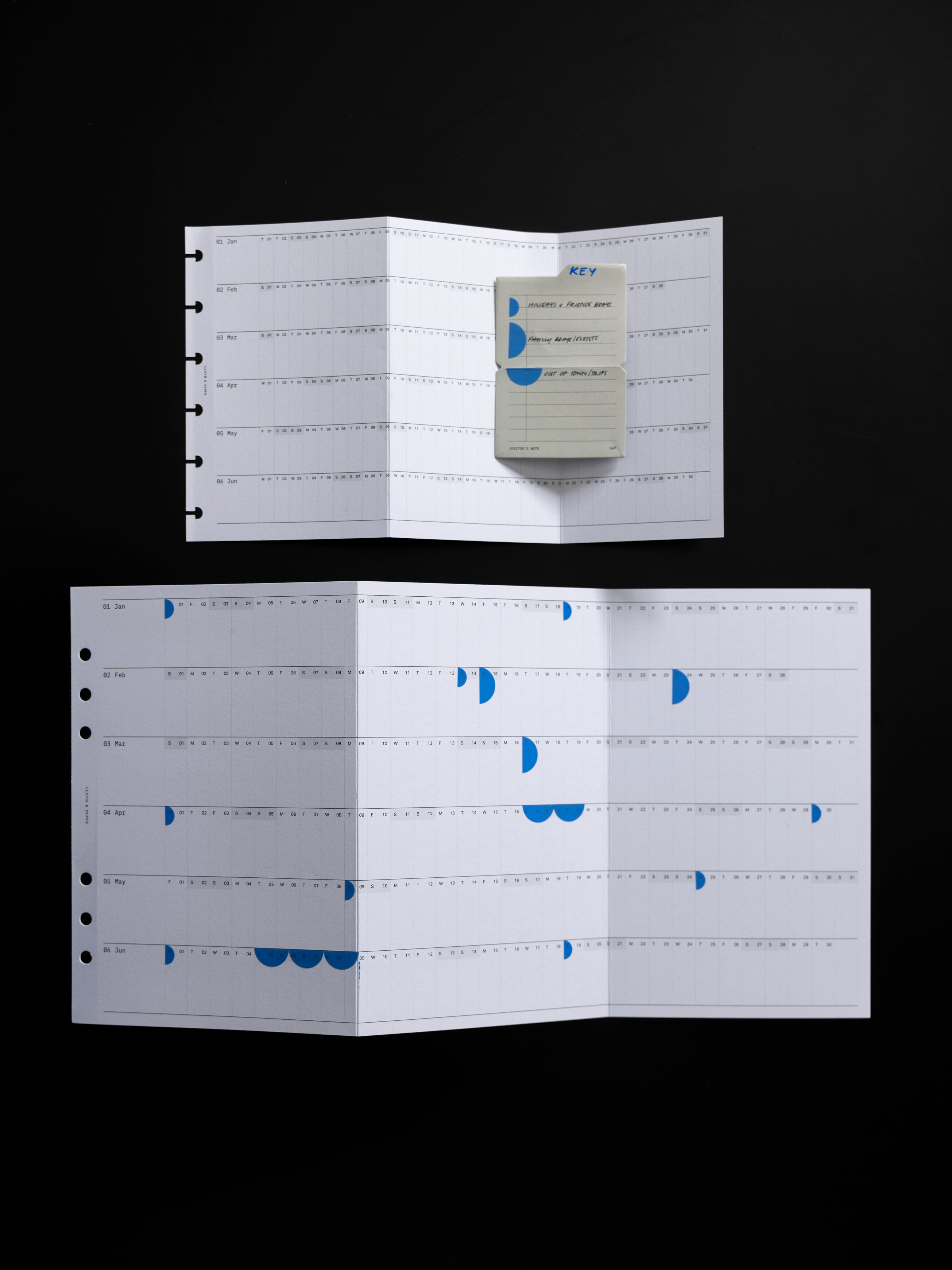 2026 Yearly Fold Out Planner Insert in CP Petite and A5 shown unfolded in use against a black background.